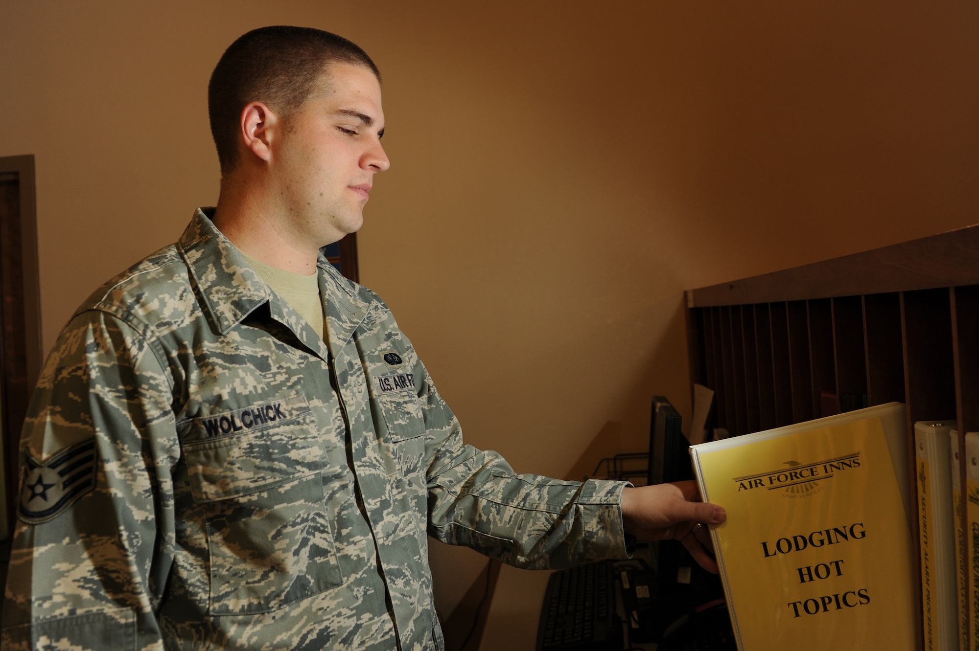 Staff Sgt. Alexander Wolchick, a services journeyman of 1st Special Operations Force Support Squadron, files a lodging binder at the Commando Inn at Hurlburt Field Fla., Sept. 26, 2012. Wolchick has worked at all available locations for services airmen at Hurlburt Field. (U.S. Air Force photo by Senior Airman Eboni Reams)