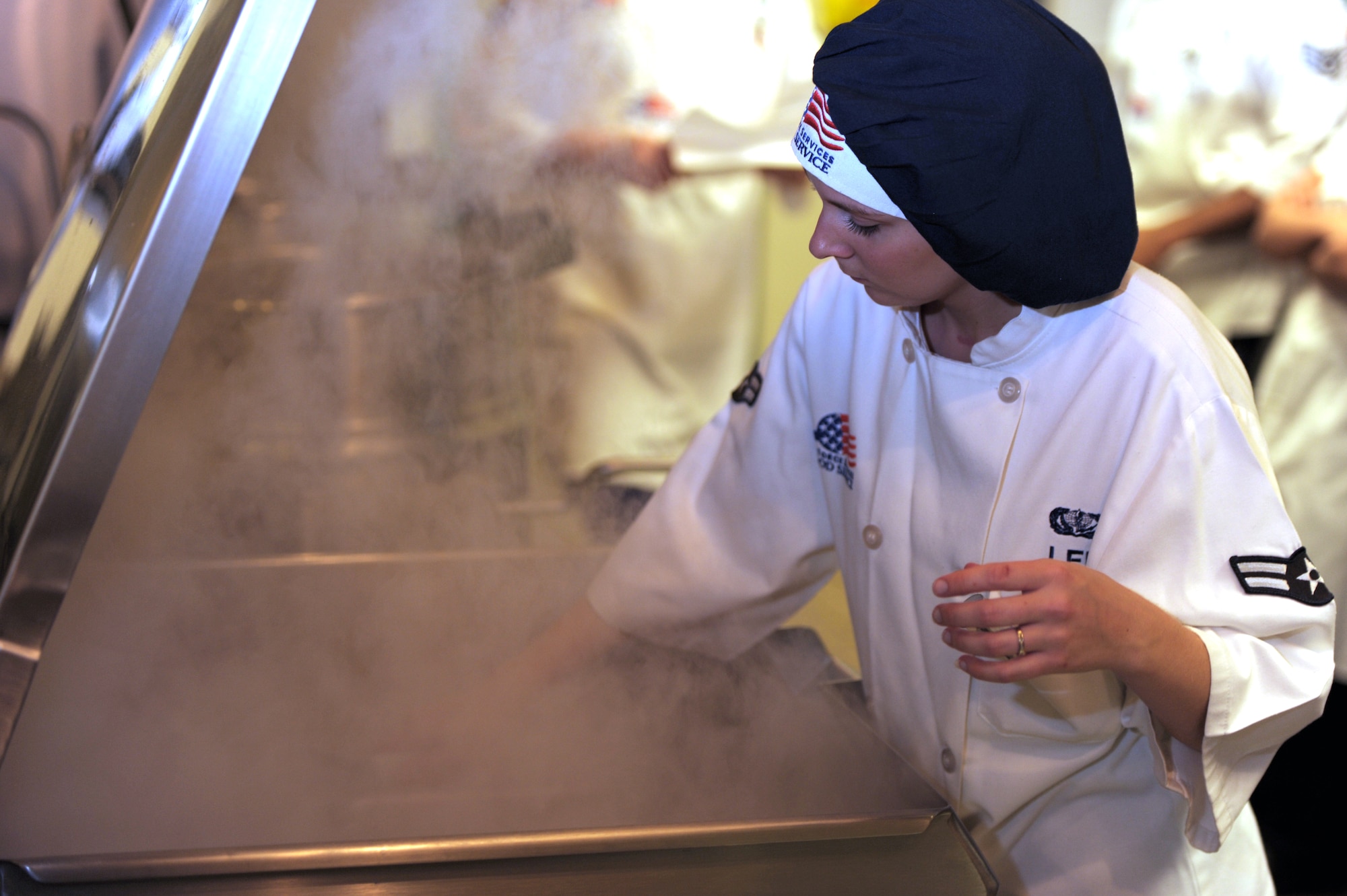 Airman 1st Class Maeve Lee, a services journeyman of 1st Special Operations Force Support Squadron, cooks ground beef at the Riptide Dining Facility at Hurlburt Field, Fla., Sept. 26, 2012. Services Airmen can work at the lodging office, fitness centers, mortuary affairs and dining facilities. (U.S. Air Force photo by Senior Airman Eboni Reams)

