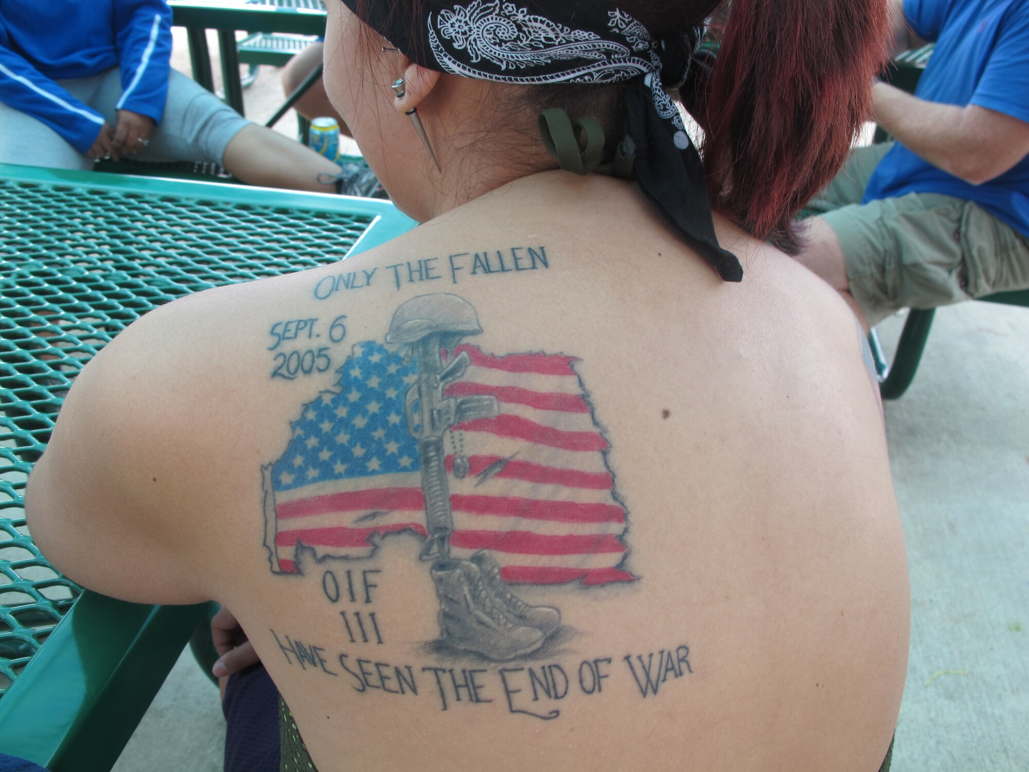 Retired Staff Sgt. Zuleika Cruz-Pereira has a tattoo honoring a friend who was killed in Iraq. Cruz-Pereira participated in an Air Force Adaptive Sports Program camp Sept. 14 and 15 at Joint Base San Antonio-Randolph, Texas, and nearby Canyon Lake. Events included wheelchair basketball, cycling with adaptive bikes, and kayaking and water skiing around Canyon Lake.  (U.S. Air Force photo/Nicole Hart)