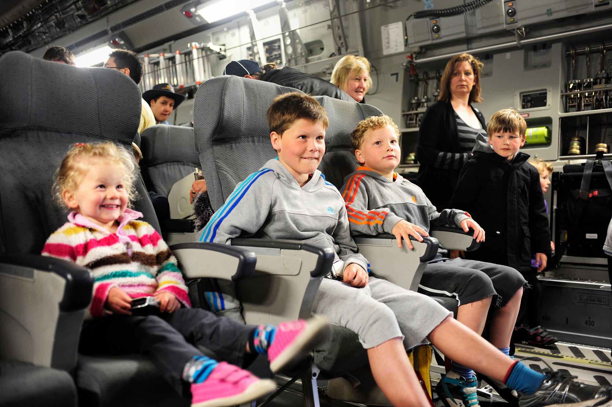 A group of children enjoy a briefing on the capabilities of the C-17 Globemaster III aircraft, Sept. 29, 2012, in Christchurch New Zealand. More than 10,000 people toured the plane, which was one of many attractions during the first ever New Zealand IceFest celebration. (U.S. Air Force photo/Staff Sgt. Sean Tobin)