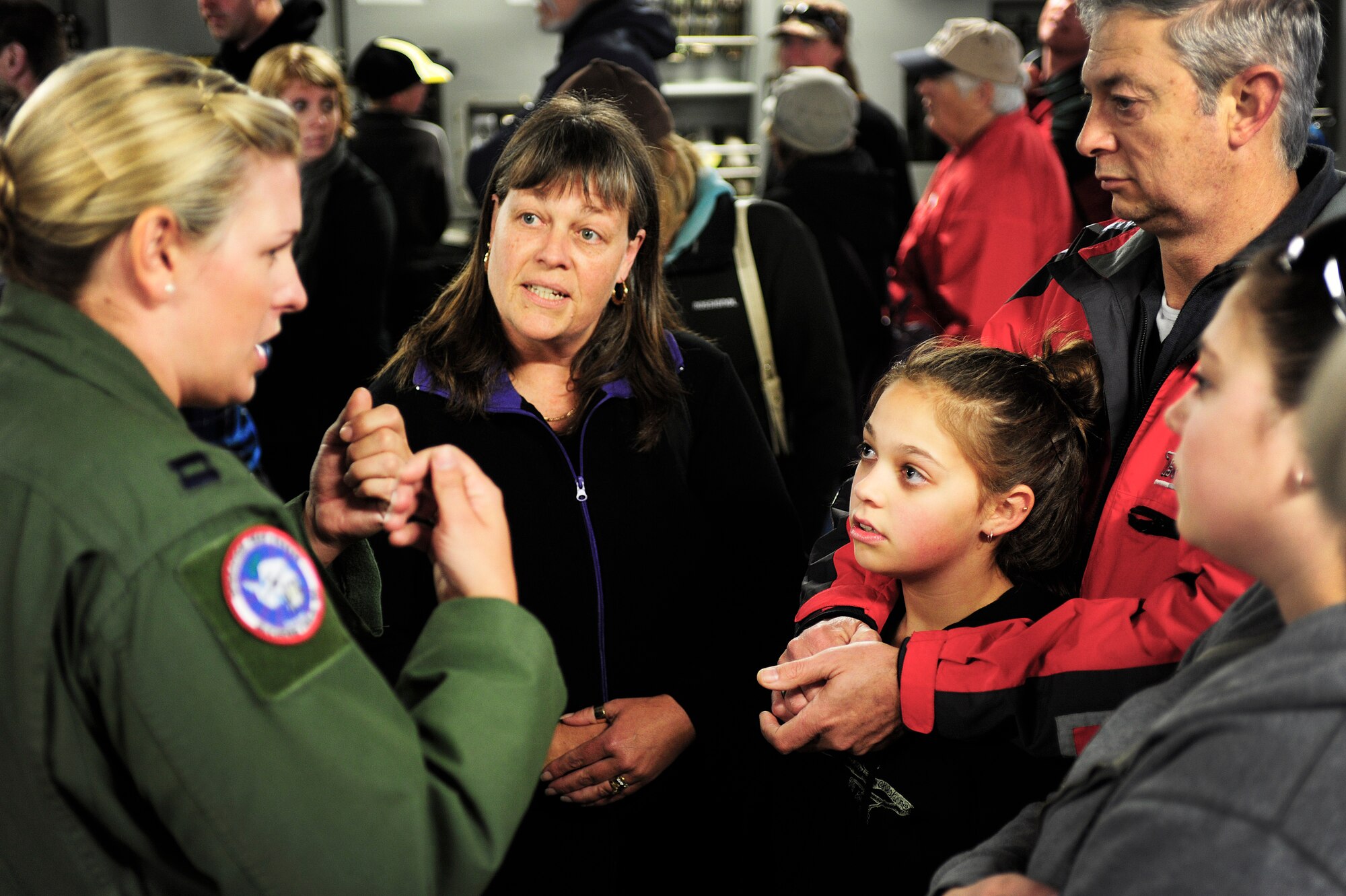Capt. Melissa Bland, 304th Expeditionary Airlift Squadron pilot, deployed from the 10th AS from Joint Base Lewis-McChord, Wash., speaks with a New Zealand family, Sept. 29, 2012, about the capabilites of the C-17 Globemaster III aircraft in Christchurch New Zealand. More than 10,000 people toured the plane, which was one of many attractions during the first ever New Zealand IceFest celebration. (U.S. Air Force photo/Staff Sgt. Sean Tobin)