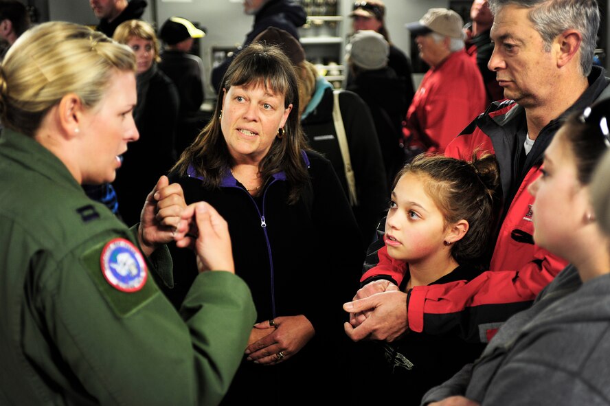 Capt. Melissa Bland, 304th Expeditionary Airlift Squadron pilot, deployed from the 10th AS from Joint Base Lewis-McChord, Wash., speaks with a New Zealand family, Sept. 29, 2012, about the capabilites of the C-17 Globemaster III aircraft in Christchurch New Zealand. More than 10,000 people toured the plane, which was one of many attractions during the first ever New Zealand IceFest celebration. (U.S. Air Force photo/Staff Sgt. Sean Tobin)