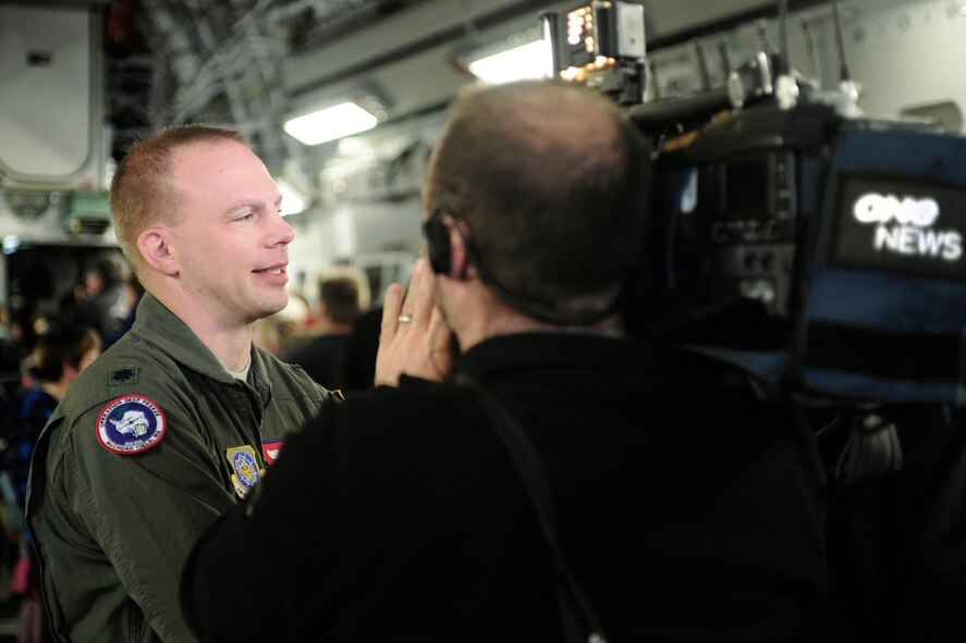 Lt. Col. Brent Keenan, 304th Expeditionary Airlift Squadron commander, deployed from Joint Base Lewis-McChord, Wash., speaks with New Zealand media, Sept. 29, 2012, about the capabilites of the C-17 Globemaster III aircraft in Christchurch New Zealand. More than 10,000 people toured the plane, which was one of many attractions during the first ever New Zealand IceFest celebration. (U.S. Air Force photo/Staff Sgt. Sean Tobin)