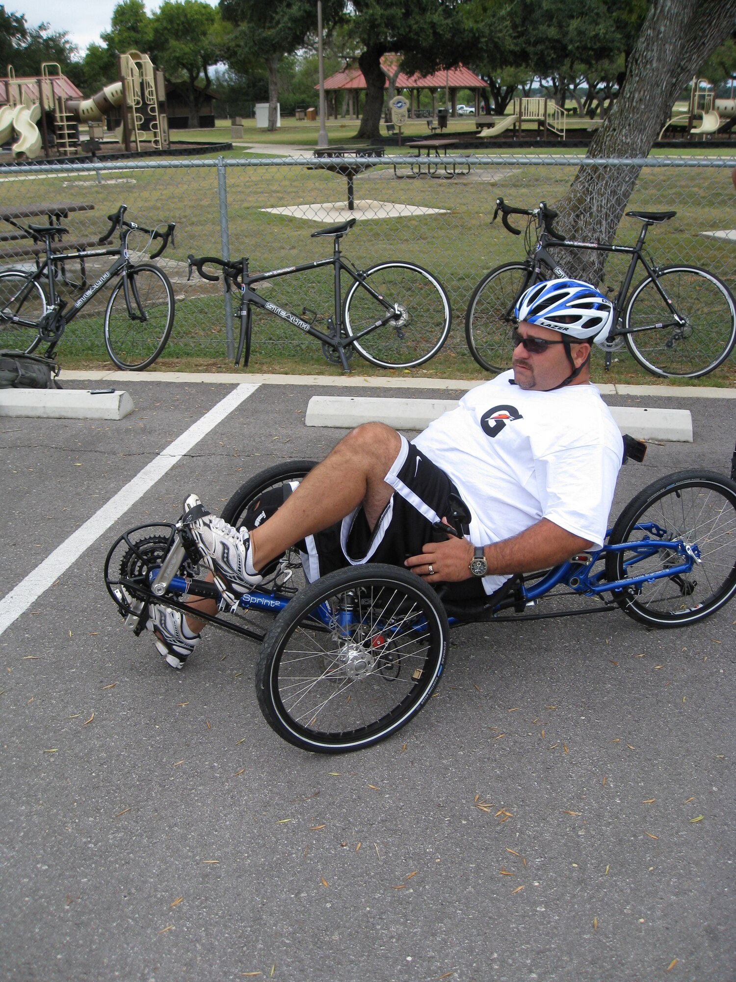 Retired Senior Master Sgt. George Stiltner gets familiar with a recumbent bike before riding along the flightline at Joint Base San Antonio-Randolph, Texas. Cycling was one of the sports offered during an Air Force Adaptive Sports Program camp Sept. 14 and 15. (U.S. Air Force photo/Tammy Cournoyer)