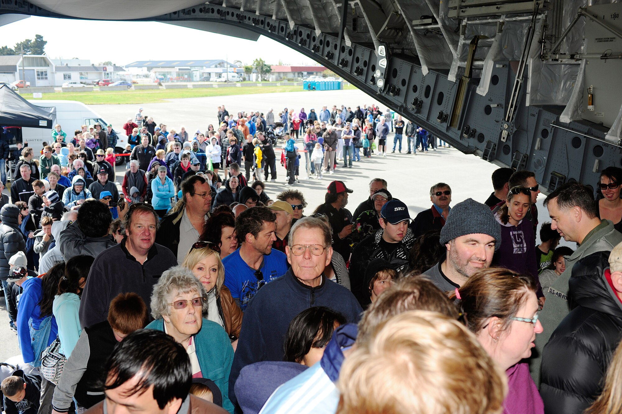 People line up to take a tour of a C-17 Globemaster III aircraft, Sept. 29, 2012 at Christchurch International Airport, New Zealand. The plane, deployed from Joint Base Lewis-McChord, accomodated more than 10,000 visitors from the Christchurch area as part of the city's IceFest event. (U.S. Air Force photo/Staff Sgt. Sean Tobin)