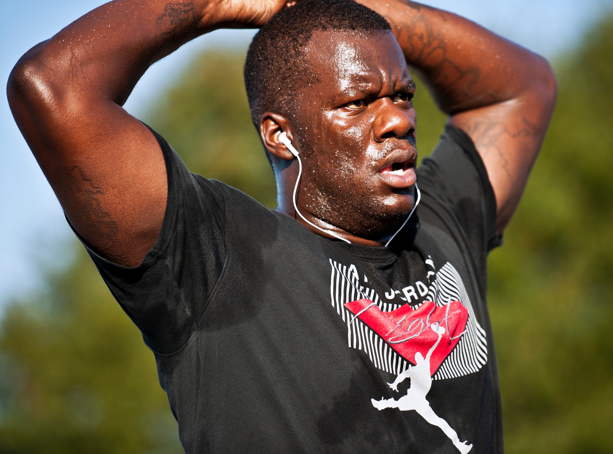 A Team Eglin member takes a breather after completing the first-ever Wounded Warrior 5K run at Eglin Air Force Base, Fla., Sept. 28.  The run was to support Leonard Anderson, a former 96th Security Forces Squadron K-9 handler, after he was wounded during a deployment to Afghanistan.  More than 200 Team Eglin members turned out to run and show their support.  (U.S. Air Force photo/Samuel King Jr.)