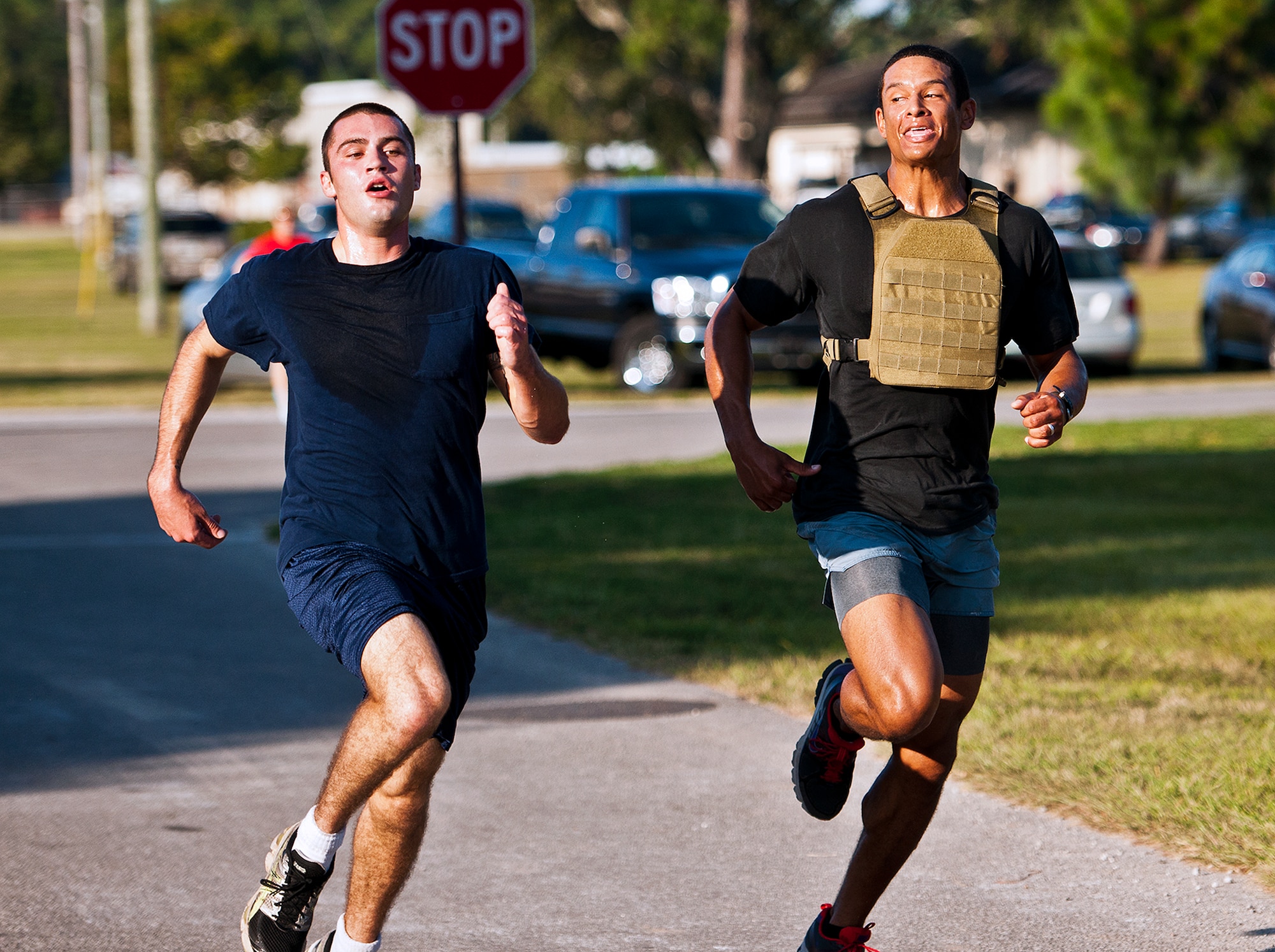 Team Eglin members race to the finish line at the first-ever Wounded Warrior 5K run at Eglin Air Force Base, Fla., Sept. 28.  The run was to support Leonard Anderson, a former 96th Security Forces Squadron K-9 handler, after he was wounded during a deployment to Afghanistan.  More than 200 Team Eglin members turned out to run and show their support.  (U.S. Air Force photo/Samuel King Jr.)