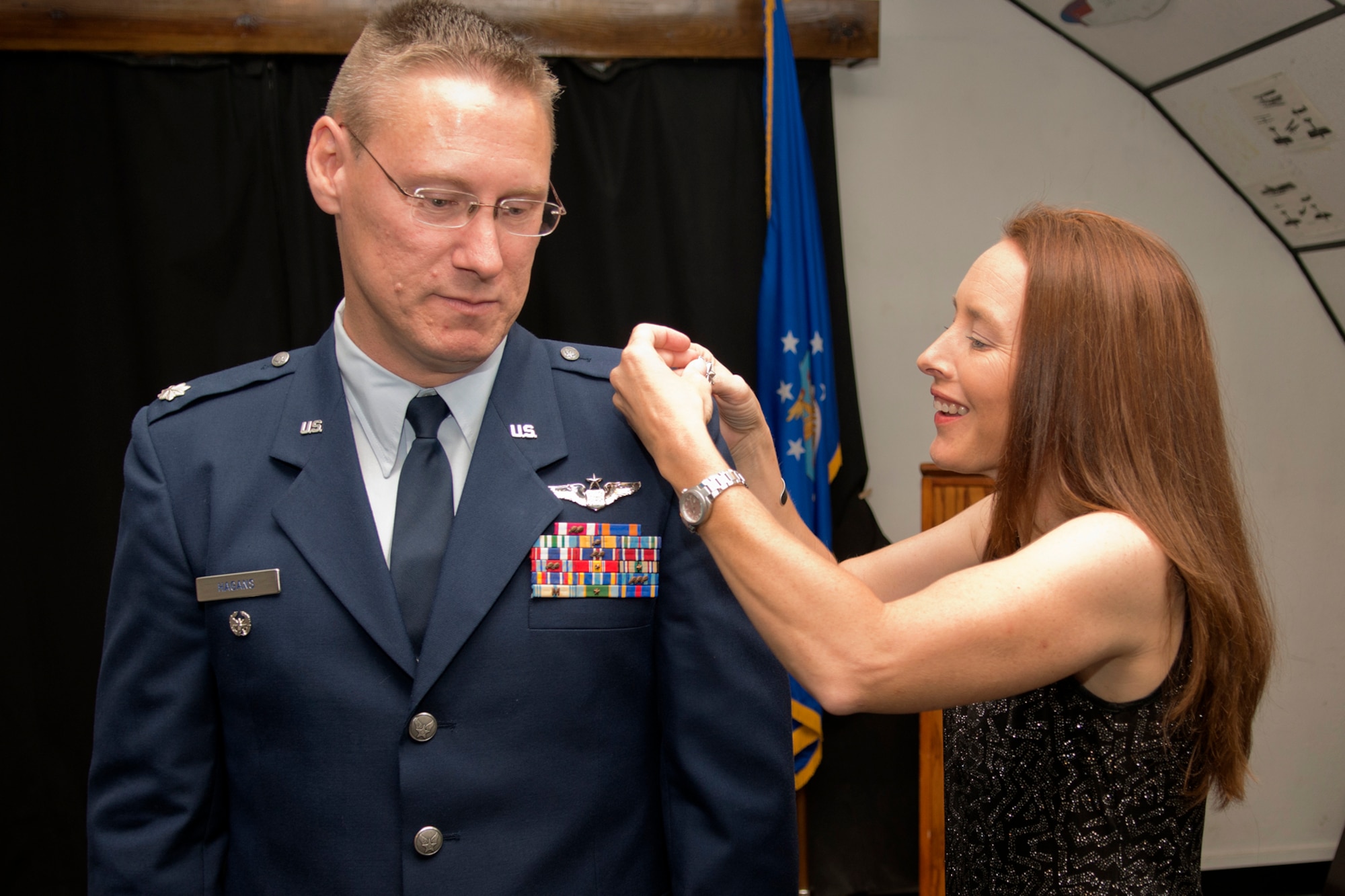 U.S. Air Force Lt. Col. Joseph Hagans gets pinned by his wife Miranda during a ceremony on Sept. 28, 2012, Barksdale Air Force Base, La. Hagans was recently promoted to Lt. Col. and is assigned to the 343rd Bomb Squadron at Barksdale. (U.S. Air Force photo by Master Sgt. Greg Steele/Released)
