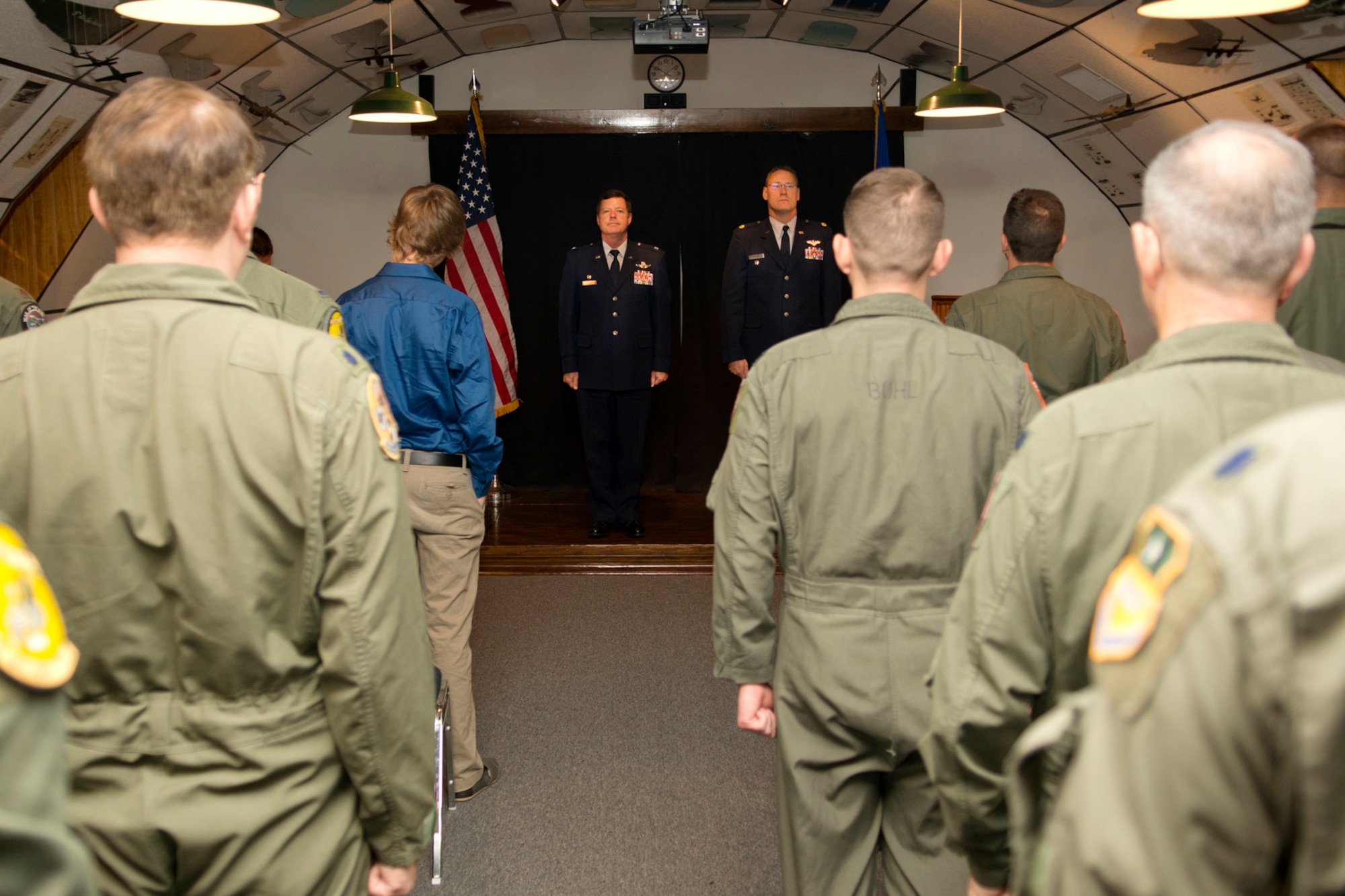 Attendees stand during the reading of the Promotion Citation during a Pinning On ceremony for U.S. Air Force Lt. Col. Joseph Hagans (right), Sept. 28, 2012, Barksdale Air Force Base, La. Hagan is a recent graduate of the B-52 Formal Training Unit and is assigned to the 343rd Bomb Squadron at Barksdale. (U.S. Air Force photo by Master Sgt. Greg Steele/Released)