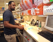 Keeli Lott, 359th Aerospace Medicine Support Squadron pharmacy technician., fills prescriptions for Joint Base San Antonio-Randolph members using the new expanded formulary at the Randolph clinic Sept. 27. (U.S. Air Force photo by Rich McFadden) 