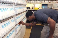 Keeli Lott, 359th Aerospace Medicine Support Squadron pharmacy technician., fills prescriptions for Joint Base San Antonio-Randolph members using the new expanded formulary at the Randolph clinic Sept. 27. (U.S. Air Force photo by Rich McFadden) 