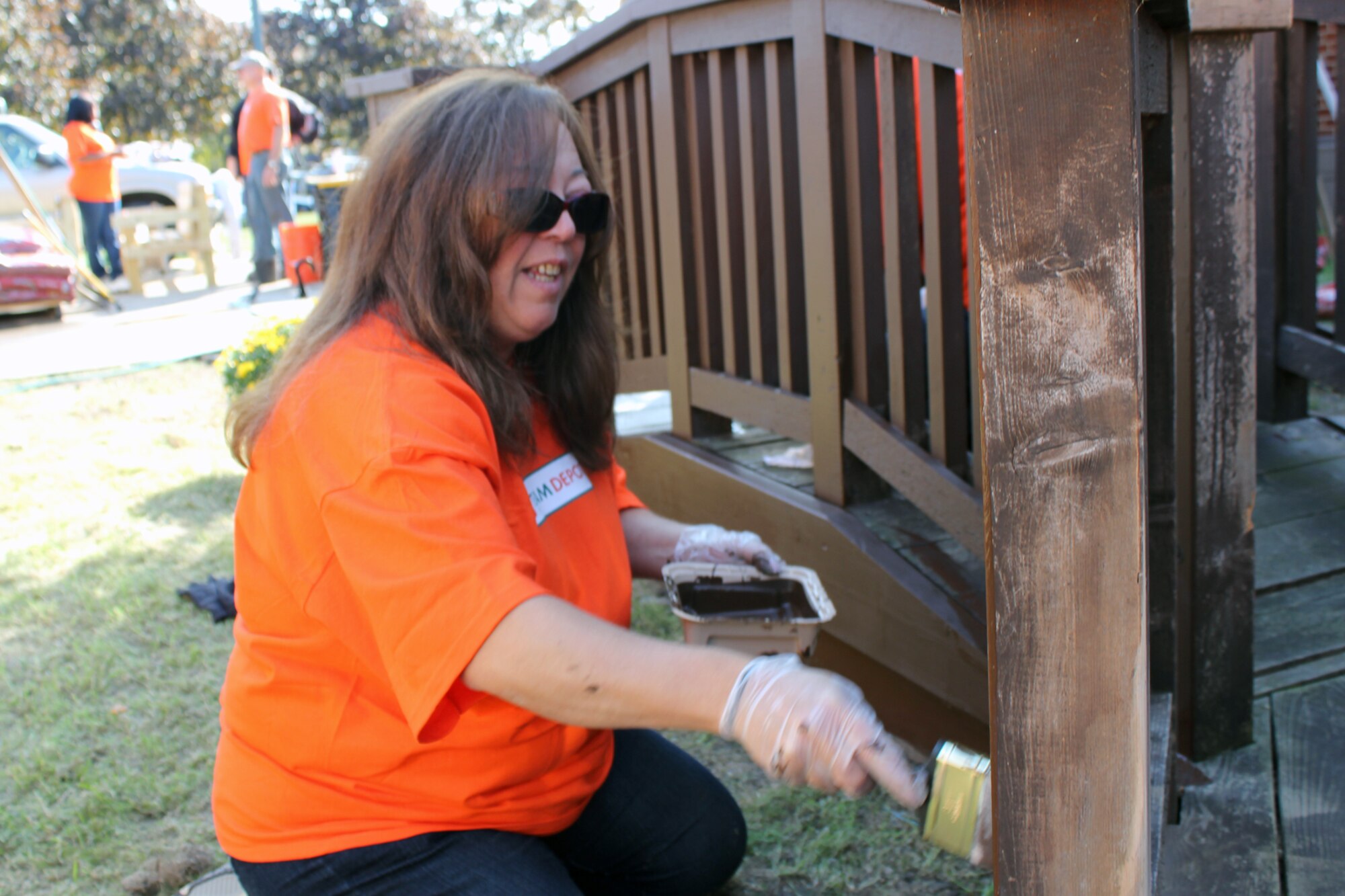 Gina Willis, a Home Depot employee and a member of that company’s volunteer team, paints a gazebo outside of the base chapel at Selfridge Air National Guard Base, Mich., Sept. 27, 2012. Volunteers from Home Depot helped to beautify the gazebo area as part of a campaign to honor area military personnel. (Air National Guard photo by TSgt. Dan Heaton)