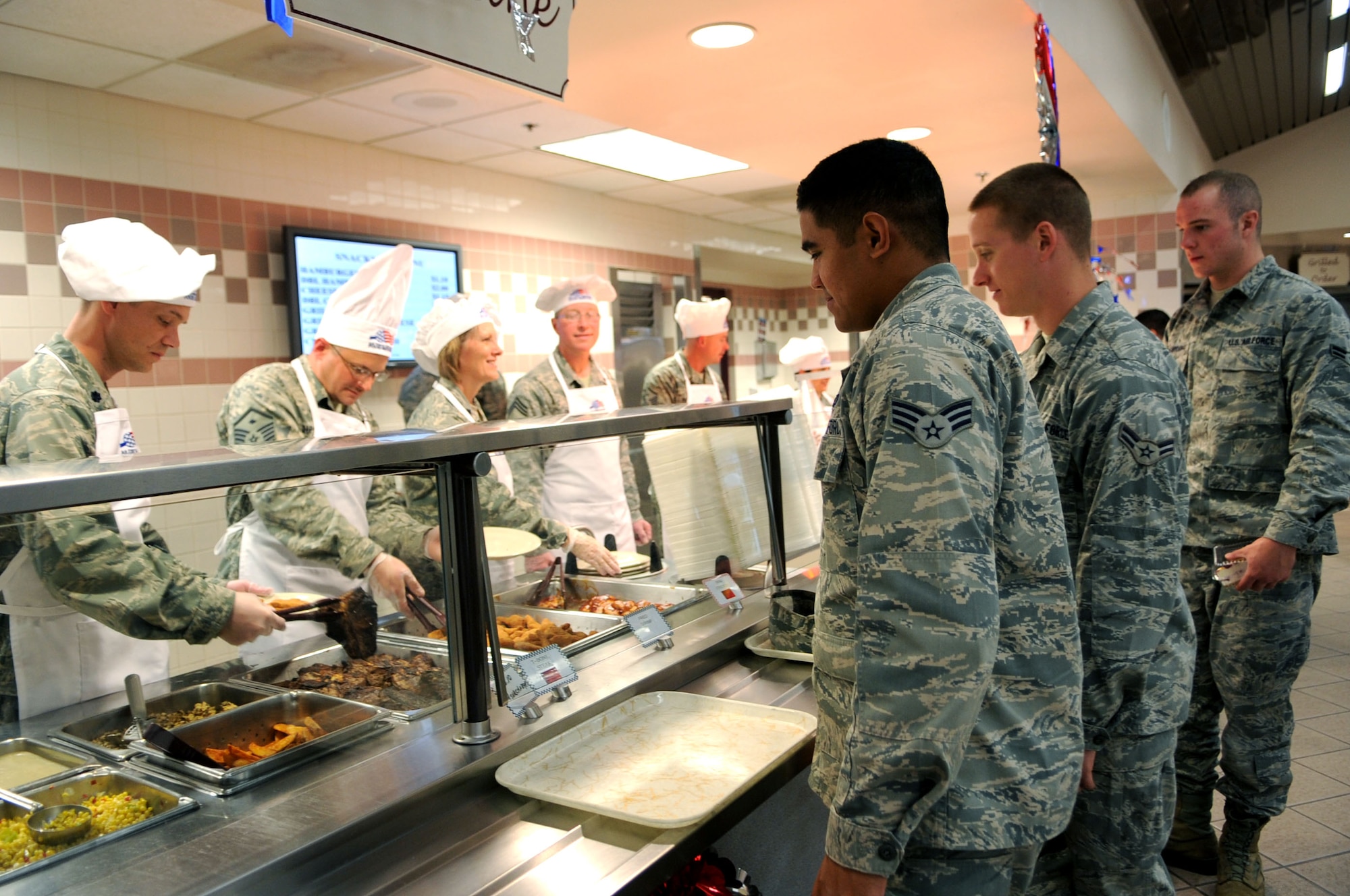 Airmen wait in line to get their meals during the Airmen Appreciation Dinner, Sept. 26, 2012, at the Airey Dining Facility on Grand Forks Air Force Base, N.D. Dinners such as this are held during different times of the year by the 319th Air Base Wing senior leadership as a way to thank the Airmen for all they do to accomplish the mission. (U.S. Air Force photo /Staff Sgt. Amanda N. Grabiec)