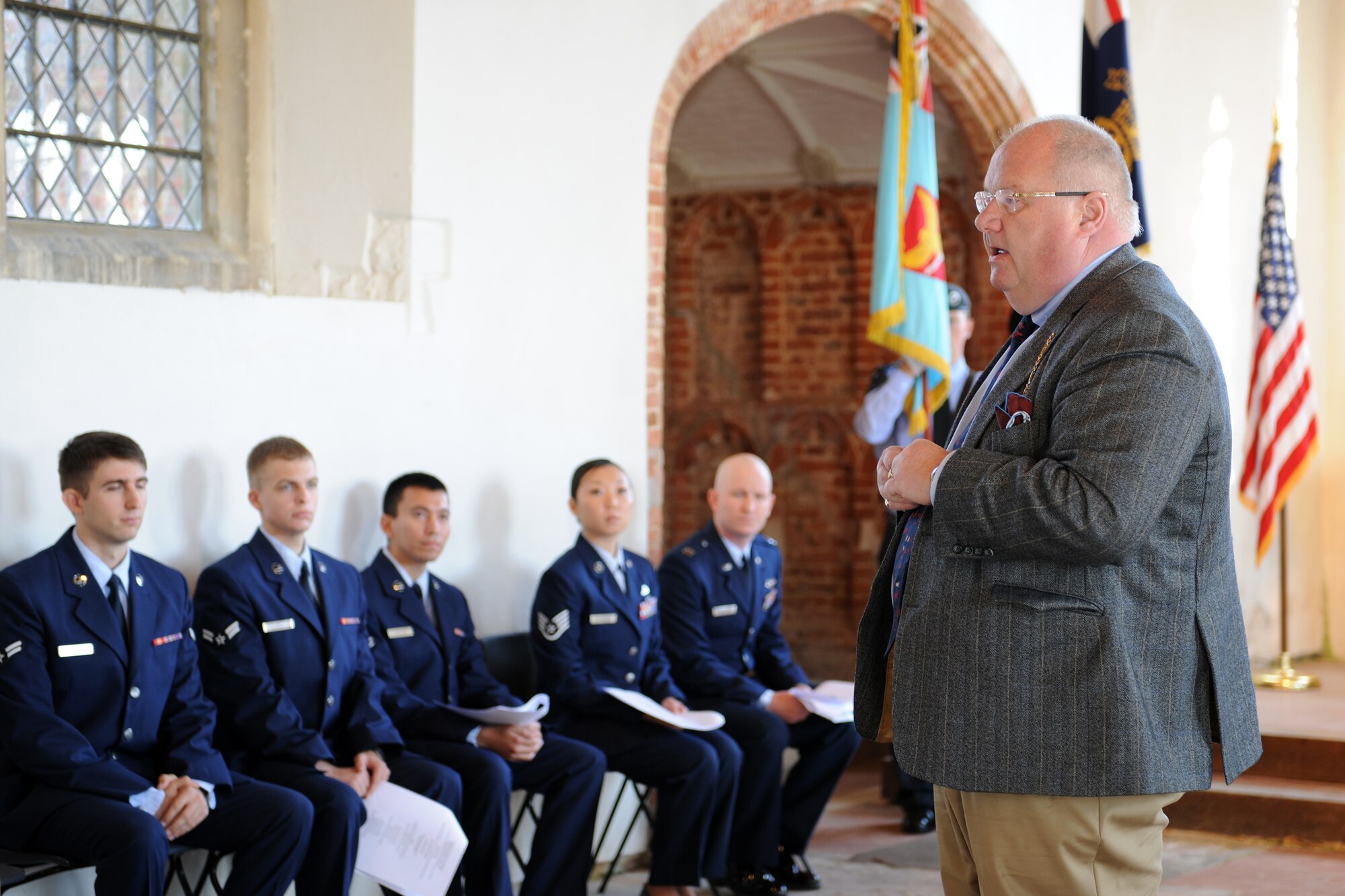 EAST HORNDON, England- Honorable Eric Pickles, Member of Parliament, speaks while Airmen assigned to RAF Mildenhall listen during a commemoration service Sept. 29, 2012, at the Church of All Saints. This service was to commemorate the 69th anniversary of the Sept. 26, 1943, air disaster involving the Dorsal Queen and Raunchy Wolf.  The two B-17 Flying Fortresses collided killing 21 Americans who were returning to England following a bombing mission during World War II. Airmen assigned to RAF Mildenhall were invited to the ceremony to present a wreath in honor of the deceased. (U.S. Air Force photo/Master Sgt. Brian M. Boisvert)