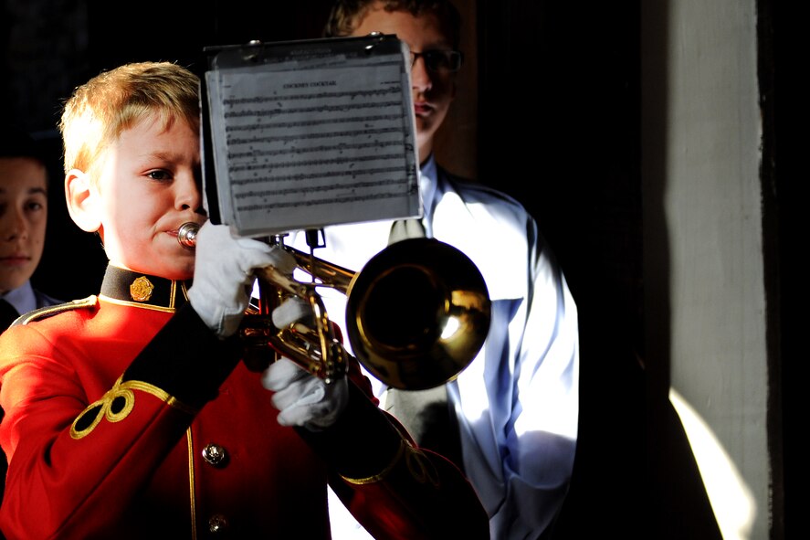 EAST HORNDON, England- George Suttle, Royal British Legion Youth Band, Brentwood, plays a trumpet military call during a commemoration service Sept. 29, 2012, at the Church of All Saints commemorating the 69th anniversary of the air disaster of the Dorsal Queen and Raunchy Wolf Sept. 26, 1943.  The two B-17 Flying Fortresses collided killing 21 Americans who were returning to England following a bombing mission during World War II. Airmen assigned to RAF Mildenhall were invited to the ceremony to present a wreath in honor of the deceased. (U.S. Air Force photo/Master Sgt. Brian M. Boisvert)