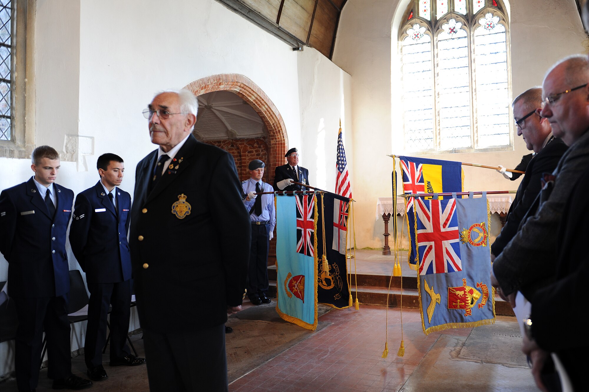 EAST HORNDON, England--Brian Kitchener, Chairman, Royal British Legion, Brentwood, leads the audience in a few minutes of silence and remembrance during a commemoration service Sept. 29, 2012, at the Church of All Saints. This service was to commemorate the 69th anniversary of the Sept. 26, 1943, air disaster involving the Dorsal Queen and Raunchy Wolf.    The two B-17 Flying Fortresses collided killing 21 Americans who were returning to England following a bombing mission during World War II. Airmen assigned to RAF Mildenhall were invited to the ceremony to present a wreath in honor of the deceased. (U.S. Air Force photo/Master Sgt. Brian M. Boisvert)