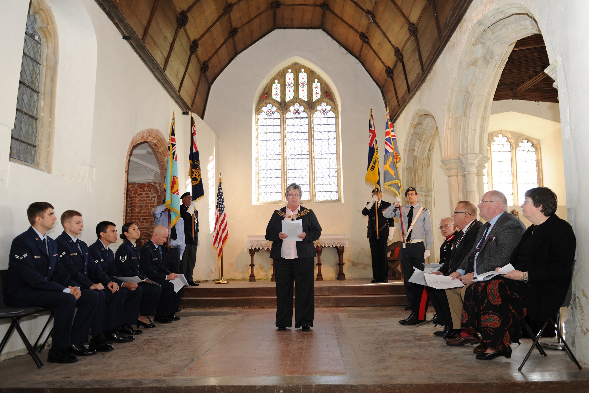 EAST HORNDON, England-- Mayoress of Brentwood, Councillor Ann Coe, speaks at a remembrance service Sept. 29, 2012, at the Church of All Saints. This service was to commemorate the 69th anniversary of the Sept. 26, 1943, air disaster involving the Dorsal Queen and Raunchy Wolf.    The two B-17 Flying Fortresses collided killing 21 Americans who were returning to England following a bombing mission during World War II. Airmen assigned to RAF Mildenhall were invited to the ceremony to present a wreath in honor of the deceased. (U.S. Air Force photo/Master Sgt. Brian M. Boisvert)