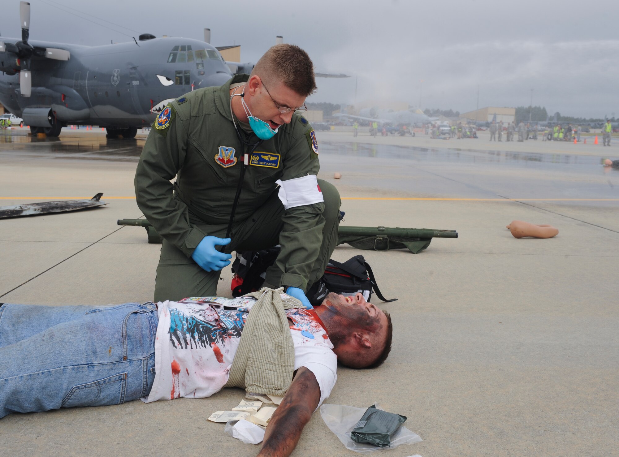 U.S. Air Force Lt. Col. David Blocker, 23d Aerospace Medicine Squadron flight surgeon, treats a moulage victim during a major accident response exercise at Moody Air Force Base, Ga., Sept. 27, 2012. The exercise was held to prepare Team Moody for emergency events requiring quick reaction. (U.S. Air Force photo by Airman 1st Class Olivia Dominique/Released)