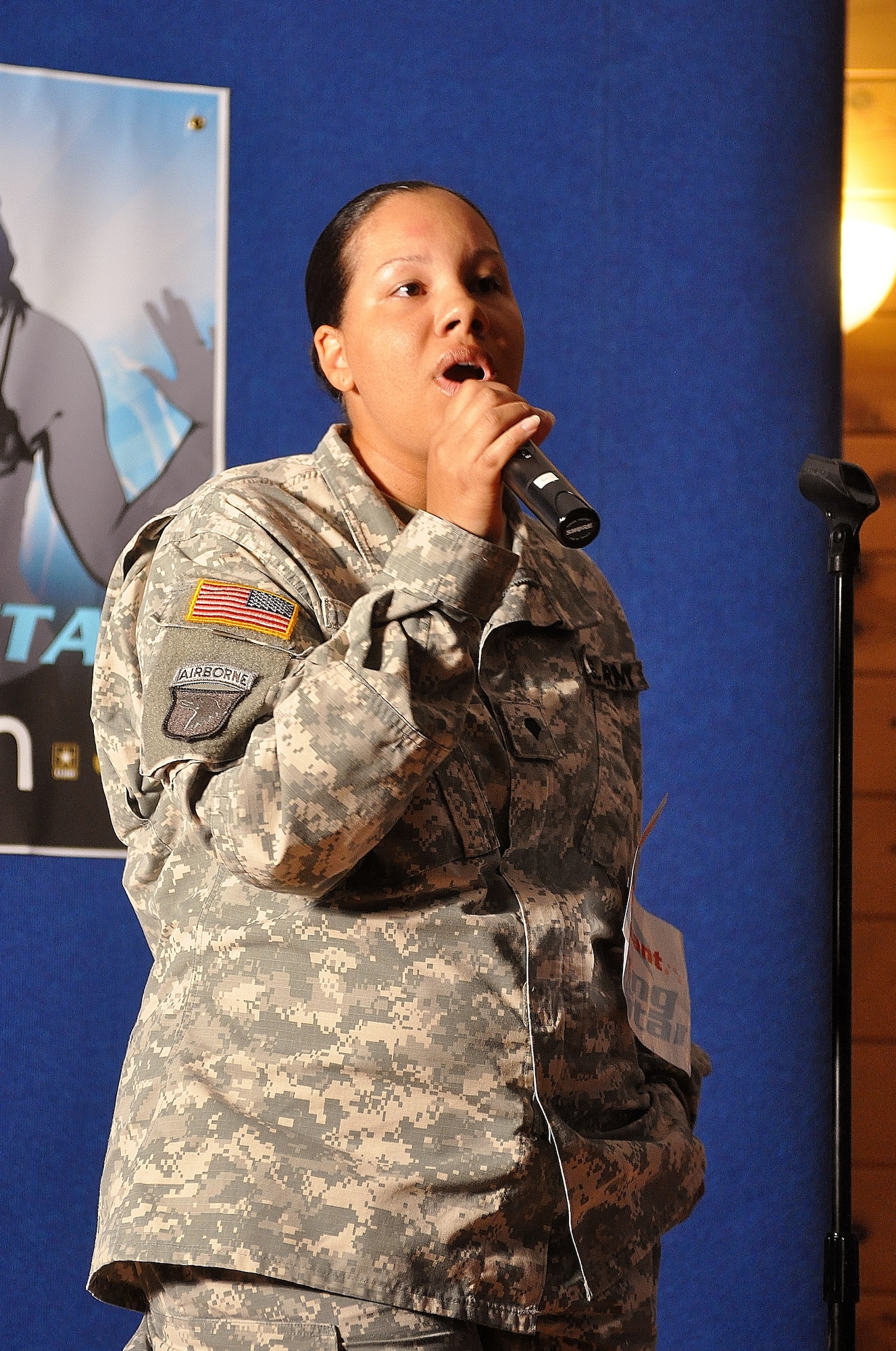 U.S. Army Spc. Danielle Blair, a Soldier assigned to the 149th Transportation Company, performs her rendition of Monica's “For You I Will,” during the Operation Rising Star competition at the Lakeside Sports Bar at Fort Eustis, Va., Sept. 26, 2012. The singing competition features active-duty, reserve and National Guard Soldiers and adult family members vying for the title of the Army's best singer. (U.S. Air Force photo by Senior Airman Jason J. Brown/Released)