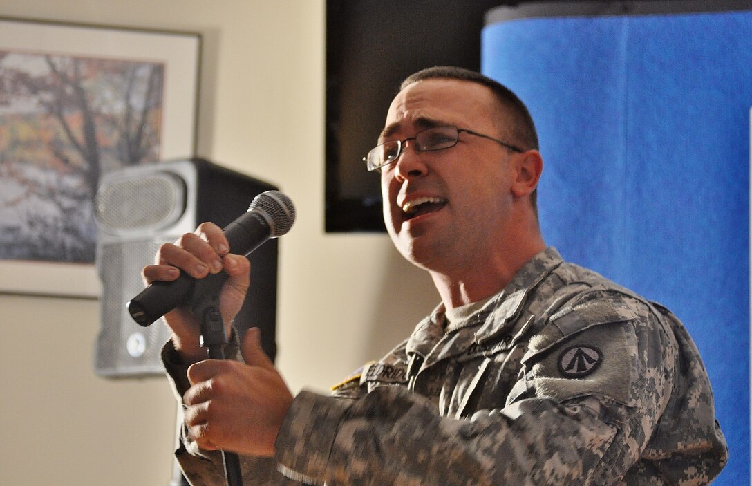 U.S. Army Spc. Reuben Eldridge,  688th Rapid Port Opening Element motor transport operator, performs his rendition of the Black Crowes “She Talks to Angels” during the Operation Rising Star competition at the Lakeside Sports Bar at Fort Eustis, Va., Sept. 26, 2012. Operation Rising Star is an Army-wide competition to name the best singing talent in the Army. (U.S. Air Force photo by Senior Airman Jason J. Brown/Released)