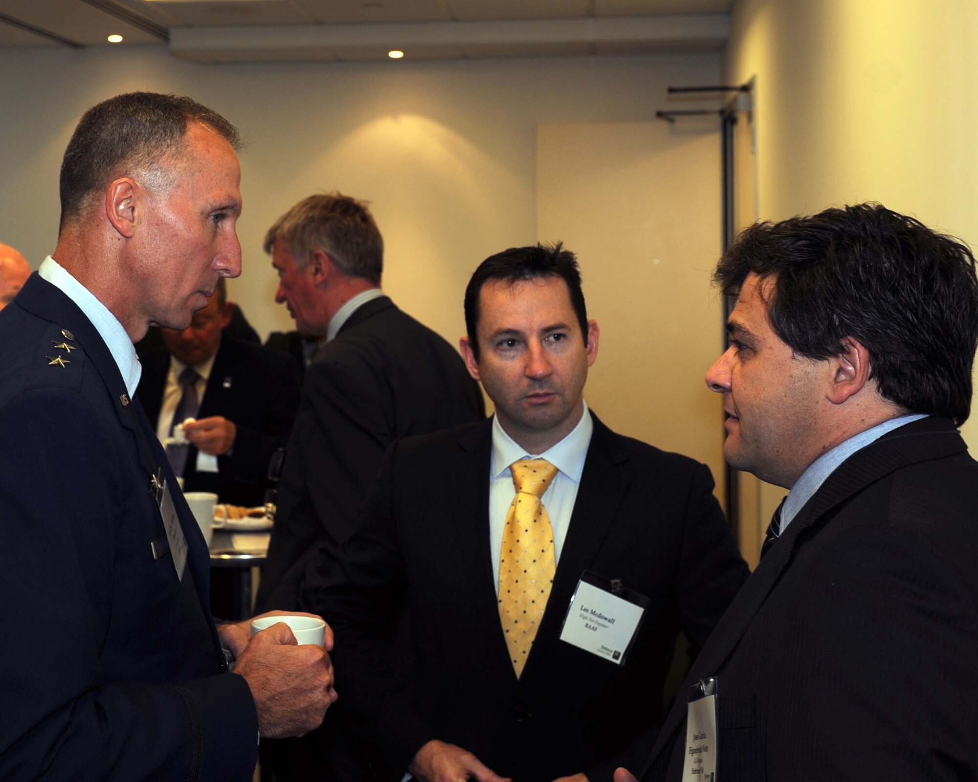From left, Maj. Gen. William Bender, U.S. Air Force Expeditionary Center commander, discusses the future of airlift with Lee McDowall, Royal Australian Air Force flight test engineer, and Jose Garcia Figueiredo Neto of Embraer Sociedad Anonima, at the Military Airlift event in London, Sept. 26, 2012. Key topics of discussion focused on ways to more effectively conduct military airlift operations. The general elaborated on the future of the C-130J Super-Hercules program, the KC-46 fleet and how NATO and the U.S. could ill afford to throw teamwork by the wayside. Additionally, Bender made a site visit to RAF Mildenhall’s 727th Air Mobility Squadron, a tenant unit there under his chain of command. (U.S. Air Force photo/2nd Lt Christopher Mesnard)