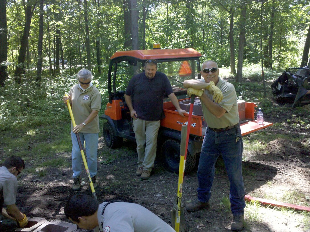 Volunteers helping to create a fire ring in Acorn Valley Youth Camping Area