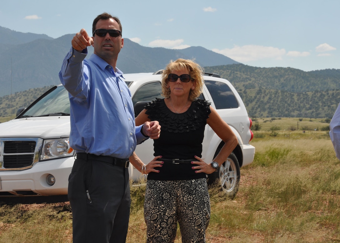 Jesse W. Laurie, a project manager in the Formerly Used Defense Sites program at the U.S. Army Corps of Engineers Los Angeles District's Tucson Resident Office, shows Dr. Christine Altendorf, the USACE Headquarters Environmental Division chief, the location of District projects on Fort Huachuca during her Aug. 29-30 visit to southern Arizona. Altendorf visited the sites to see the scope and progress of the District's sustainability initiatives.