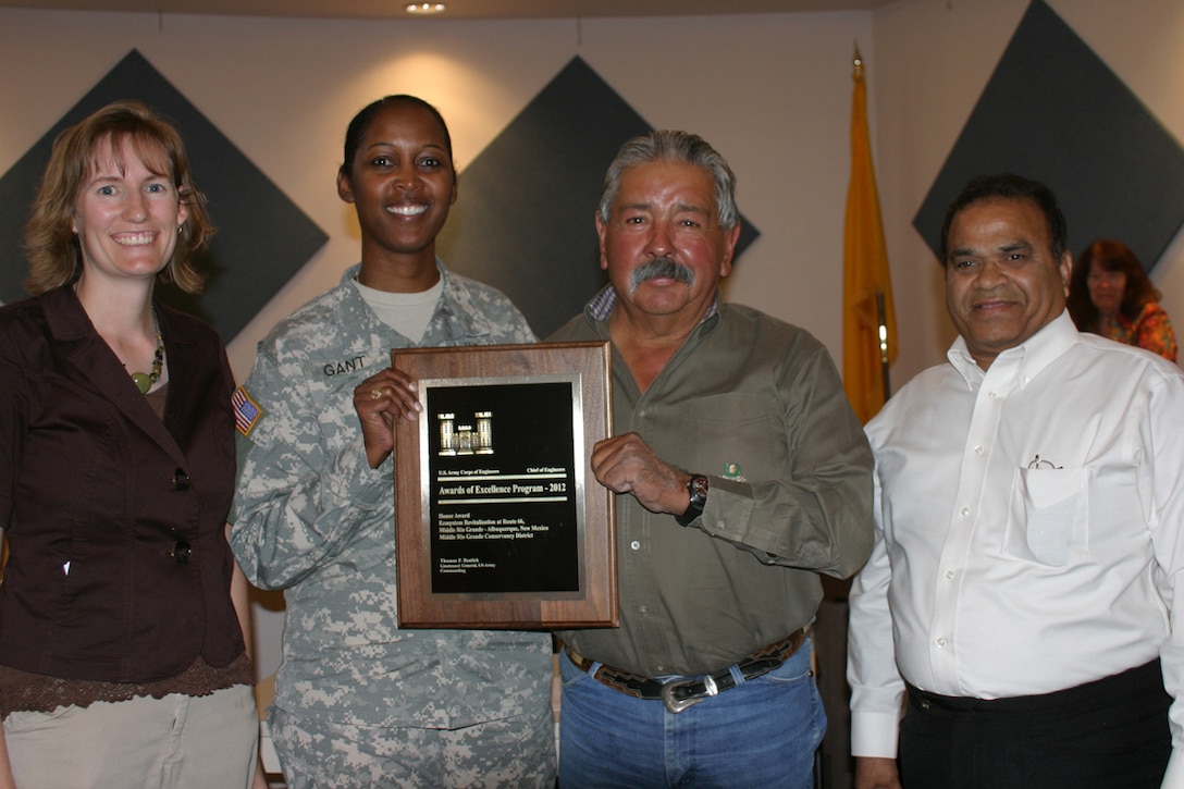 From L to R: District Project Manager Alicia Austin Johnson, District Commander Lt. Col.
Antoinette Gant, Middle Rio Grande Conservancy District Vice-Chair Eugene Abeita, and
MRGCD Chief Engineer Subhas K. Shah accept the award for ecosystem revitalization work in the Rio Grande Bosque, providing foraging and nesting habitat for 80 percent of vertebrate species in the region.

