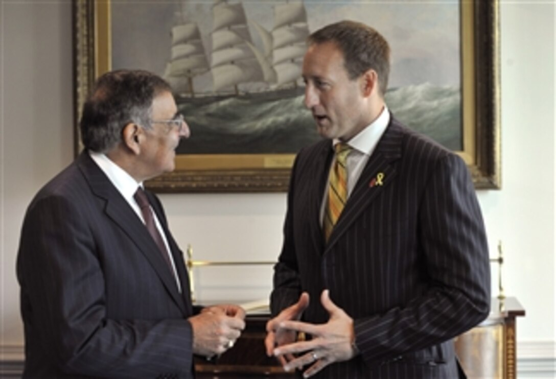 Secretary of Defense Leon E. Panetta, left, and Canadian Minister of National Defence Peter MacKay chat informally before sitting down for a meeting in the Pentagon on Sept. 28, 2012.  Panetta and MacKay are meeting to discuss national security items of interest to both nations.  