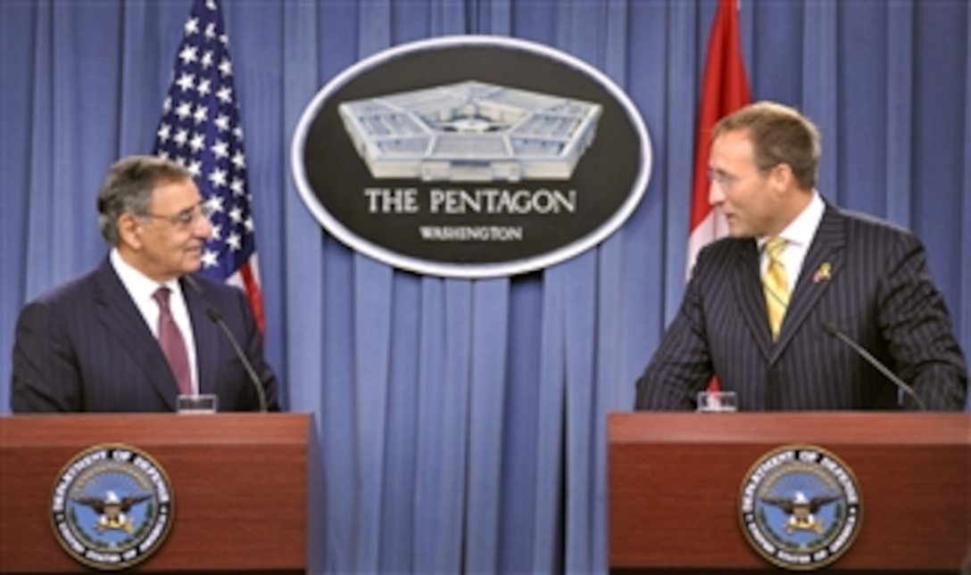 Secretary of Defense Leon E. Panetta, left, listens to Canadian Minister of National Defence Peter MacKay during a joint press conference in the Pentagon Press Briefing Room on Sept. 28, 2012.  Panetta, MacKay, and their senior staffs met earlier to discuss national security items of interest to both nations.  