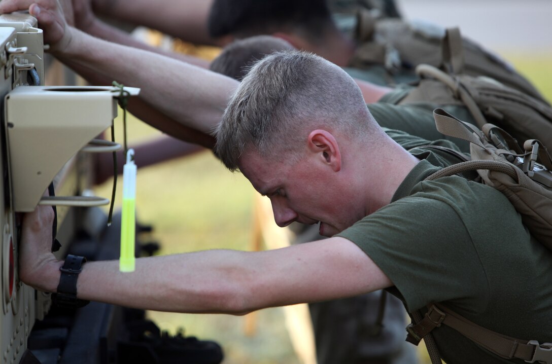 Marines with Combat Logistics Battalion 6, 2nd Marine Logistics Group push a humvee during a physical training competition aboard Camp Lejeune, N.C., Sept. 27, 2012. The Marines completed other stations like casualty evacuations and setting up a landing zone. 