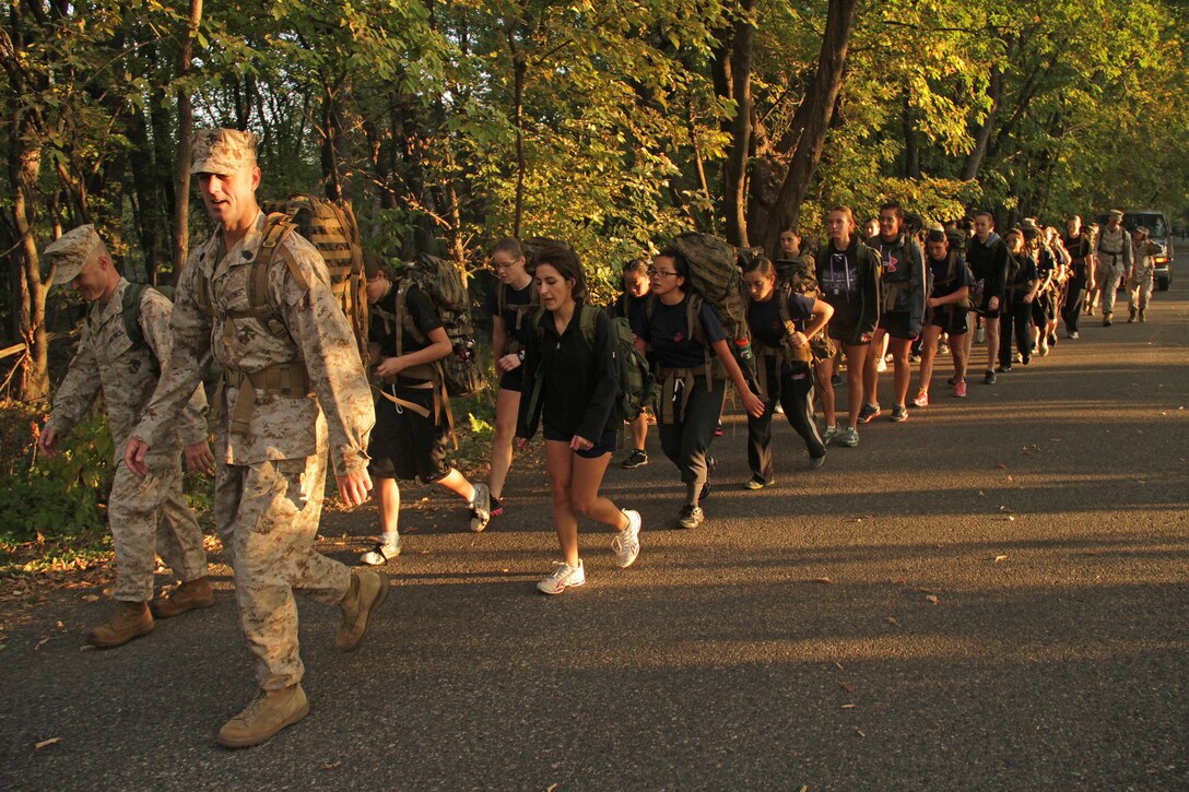 Recruiting Station Twin Cities Commanding Officer Maj. Kenneth Gawronski and Sgt. Maj. Sean Cox lead 28 members of the Delayed Entry Program on a five-mile hike during a female pool function on Sept. 30. For additional imagery from the event, visit www.facebook.com/rstwincities. 