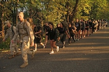 Recruiting Station Twin Cities Commanding Officer Maj. Kenneth Gawronski and Sgt. Maj. Sean Cox lead 28 members of the Delayed Entry Program on a five-mile hike during a female pool function on Sept. 30. For additional imagery from the event, visit www.facebook.com/rstwincities. 