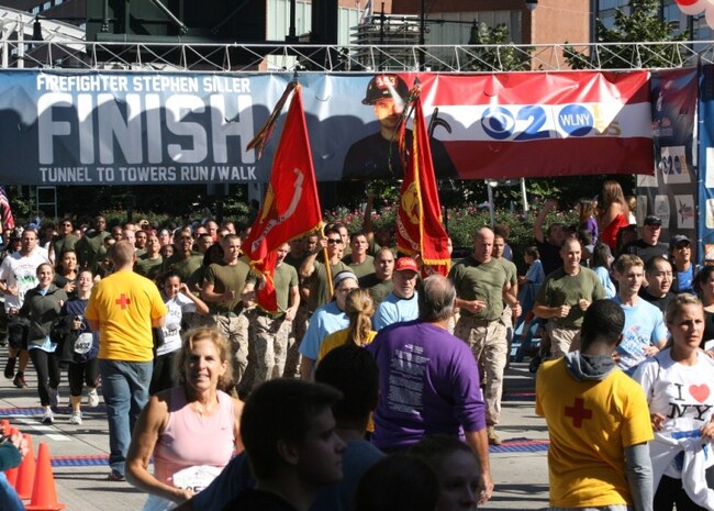 NEW YORK -- Marines ran the New York City Tunnel to Towers Run, Sept. 30. United States Military Academy at West Point cadets and FDNY firefighters lined the final stretch of the run. The run is in support of the Stephen Siller Tunnel to Towers Foundation, which works to build homes for injured troops and provide scholarships to the children of fallen service members and firefighters. Siller was an off-duty New York City firefighter who headed back to the city to help after the attacks on 9/11. When he reached as far as car traffic would allow he strapped his 65-lbs of gear on ran through the Brooklyn Battery Tunnel to join his fellow firefighters. The 5km run retraces his steps to the base of the World Trade Center. Siller died while helping with the rescue effort.