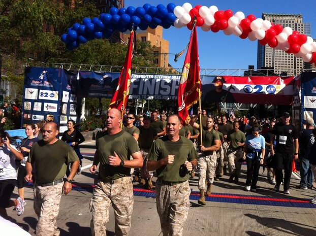 NEW YORK -- Marines ran the New York City Tunnel to Towers Run, Sept. 30. United States Military Academy at West Point cadets and FDNY firefighters lined the final stretch of the run. The run is in support of the Stephen Siller Tunnel to Towers Foundation, which works to build homes for injured troops and provide scholarships to the children of fallen service members and firefighters. Siller was an off-duty New York City firefighter who headed back to the city to help after the attacks on 9/11. When he reached as far as car traffic would allow he strapped his 65-lbs of gear on ran through the Brooklyn Battery Tunnel to join his fellow firefighters. The 5km run retraces his steps to the base of the World Trade Center. Siller died while helping with the rescue effort. (Official Marine Corps photo by Sgt. Randall Clinton)