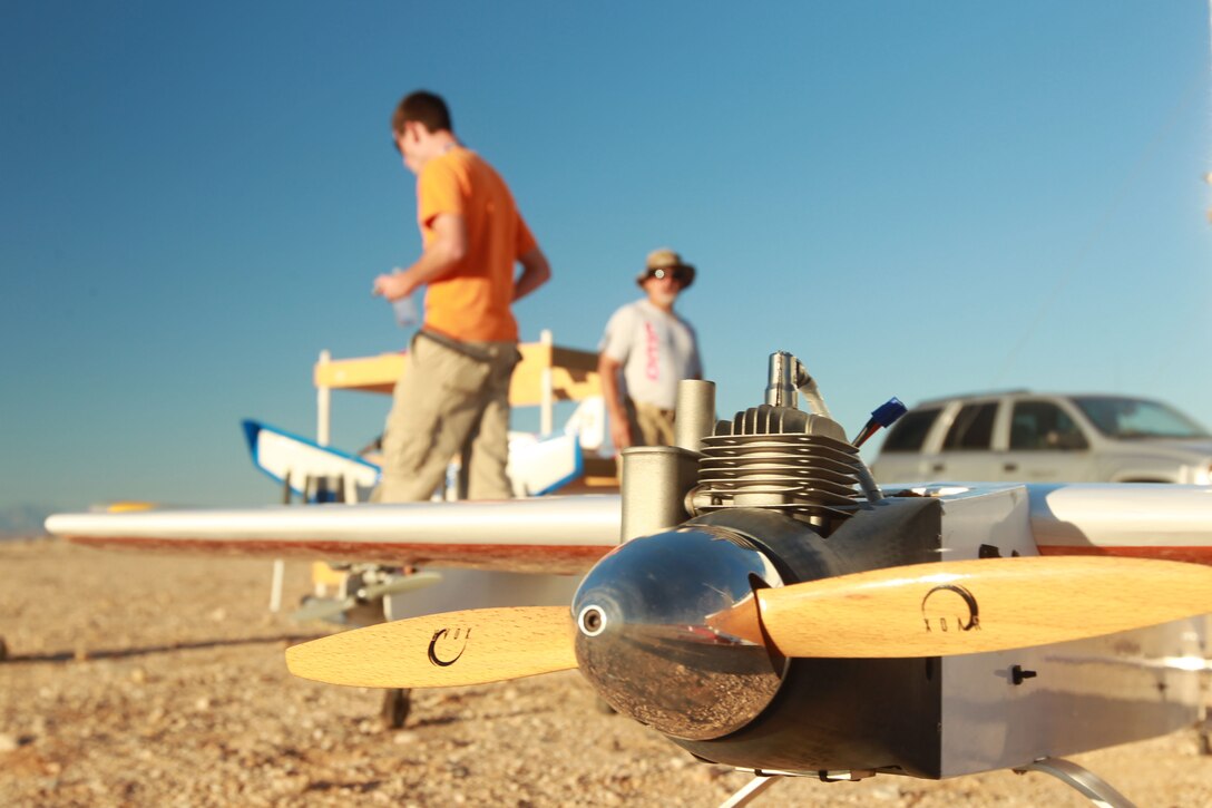 An unmanned aerial vehicle sits while airmen and civil service workers prepare to test their experiments detecting UAVs at Range 220. The workers teamed up for the Commander’s Challenge 2012. This years challenge was to find a way to detect and track a small unmanned aerial vehicle through an urban environment.