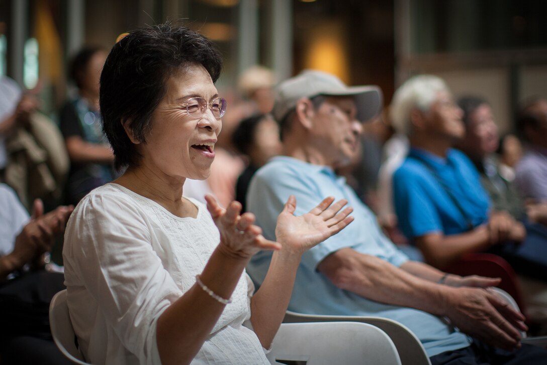 SAITAMA, Japan -- A Japanese woman sings and claps along on Pacific Trends' rendition of "Sekai Ni," a popular modern Japanese song, at the Saitama Super Arena Keyaki Square, Saitama, Japan on Oct. 2, 2012. Audience members cheered and chanted "encore" before Trends responded with "Sekai Ni." (U.S. Air Force photo/Staff Sgt. Josh Voyles)