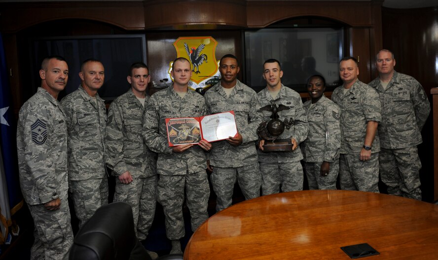 U.S. Air Force Col. Brian McDaniel, 18th Wing vice commander, and Chief Master Sgt. Mark Marson, 18th Wing command chief, stand with the three Senior Airmen, and their supervisors, after their completion of the Strategic Corporal’s Course 530-12 at Kadena Air Base, Japan, Oct. 2, 2012. The primary focus of the course is leadership, professionalism and fitness for up-and-coming leaders of the U.S. Marine Corps, Air Force, and Army. (U.S. Air Force photo/Airman 1st Class Hailey Davis)