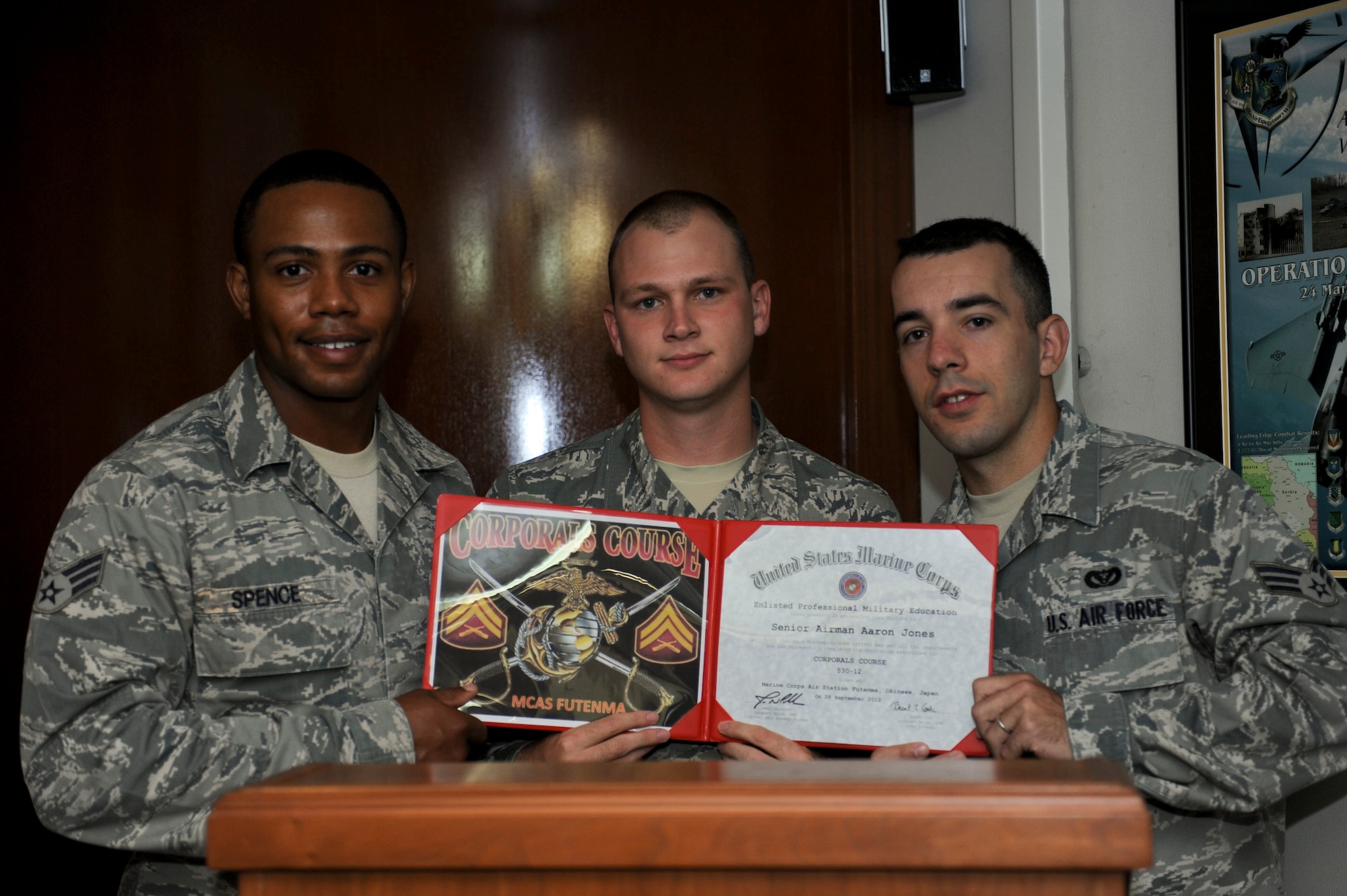 Senior Airmen Raynard Spence, 18th Maintenance Group, Aaron Jones and Sasha Korjenic, 18th Civil Engineer Squadron, pose with the graduation certificate for the Strategic Corporals Course 530-12 at Kadena Air Base, Japan, Oct. 2, 2012. (U.S. Air Force photo/Airman 1st Class Hailey Davis)