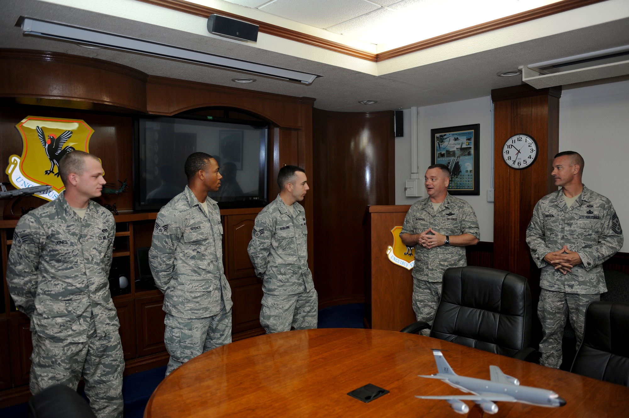 U.S. Air Force Col. Brian McDaniel, 18th Wing vice commander, congratulates three senior airmen after their completion of the Strategic Corporals Course 530-12 at Kadena Air Base, Japan, Oct. 2, 2012. The Course is a three-week professional military education course designed to provide leadership skills, as well as field training, to U.S. Marine Corps, Air Force, and Army E-4 rank service members. (U.S. Air Force photo/Airman 1st Class Hailey Davis)