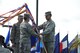 Lt. Gen. Stanley T. Kresge, former 13th Air Force commander, passes the guidon to Gen. Herbert J. 