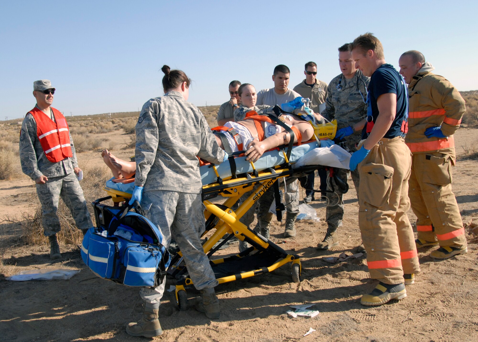 First responders prepare to transport the METIman mannequin during exercise Desert Wind 13-01 after demonstrating their emergency response capability to the Exercise Evaluation Team Oct. 1. 