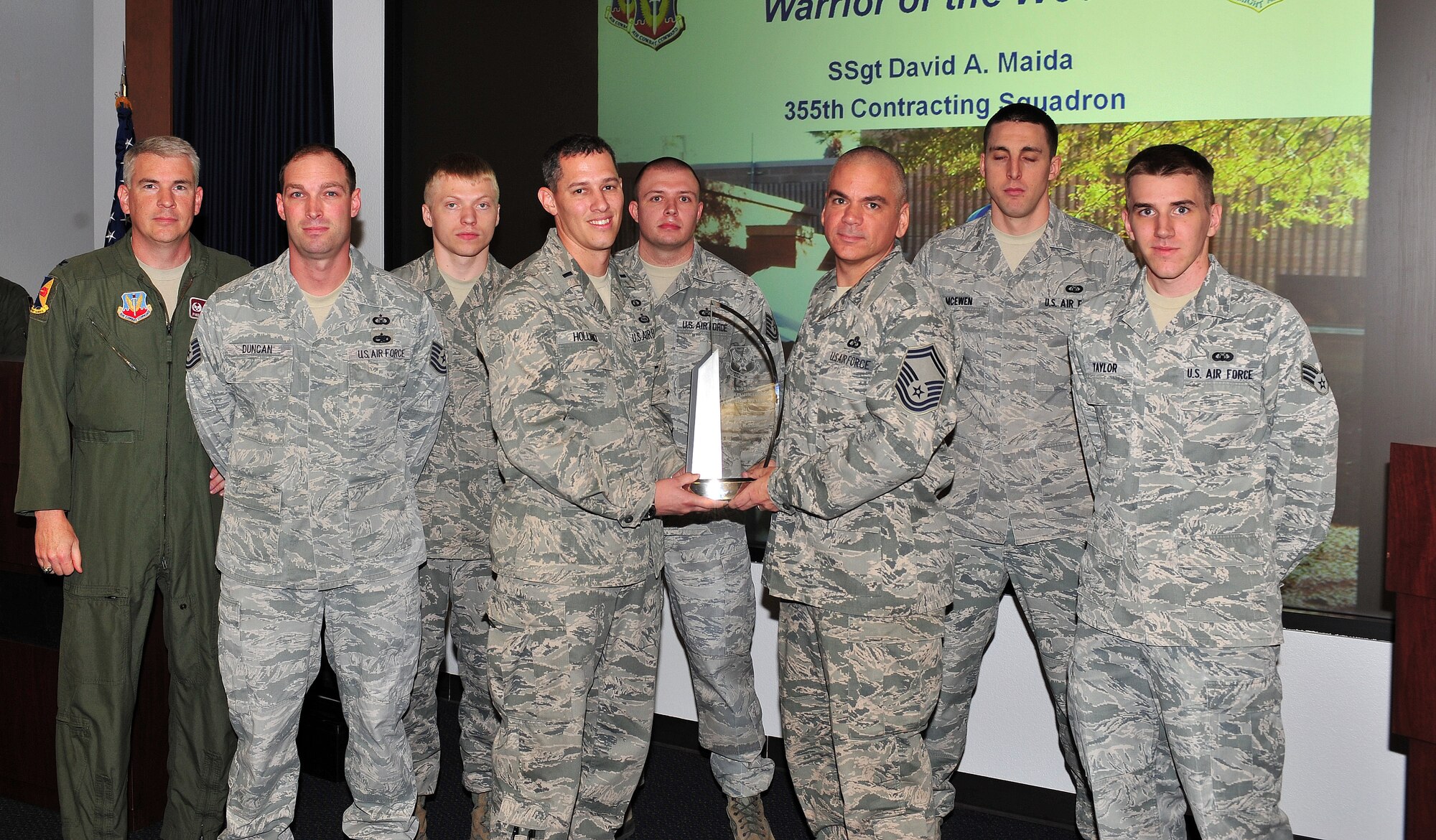 Airmen from the 355th Operations Support Squadron, accept the D. Ray Hardin award for best air traffic control facility in the Air Force. (U.S. Air Force photo by Airman 1st Class Joshua Slavin/Released)