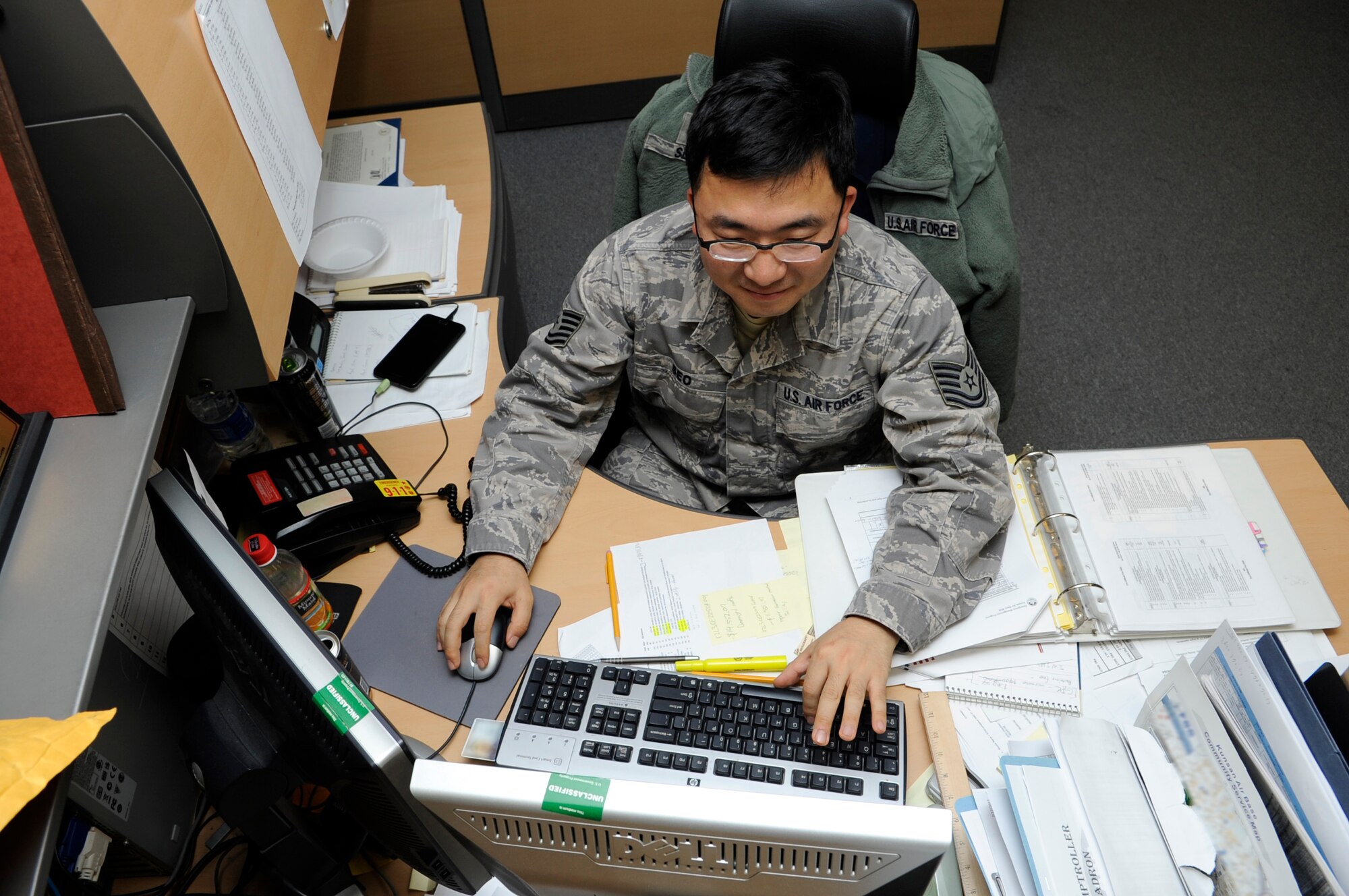 Tech. Sgt. Felix Seo, 8th Comptroller Squadron financial analyst, works during the closeout of the fiscal year Sept. 28, 2012, at Kunsan Air Base, Republic of Korea. During the closeout weekend, the analysts put in more than 200 man-hours to make sure the Wolf Pack had funds for base projects such as repairing damages from the recent typhoons. (U.S. Air Force photo/Senior Airman Brigitte N. Brantley)