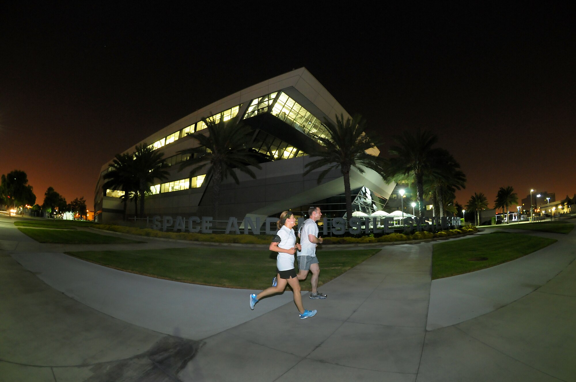 Teams of runners run through the night during the POW-MIA Day torch run, Sept. 20.   The 24-hour relay culminated with a wreath laying ceremony, Sept. 21. (Photo by Joe Juarez)