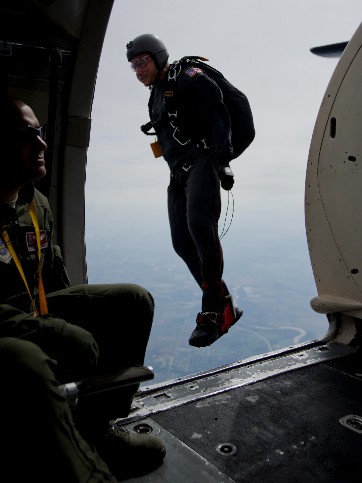 A U.S. Army Golden Knight member jumps out during the Golden Knights performance over McConnell Air Force Base., Kan. The Knights performed during the 2012 “Wings over McConnell” Open House and Air Show. The base opened its gates to the public to showcase its Airmen and mission. (U.S. Air Force photo/Senior Airman Armando A. Schwier-Morales) 