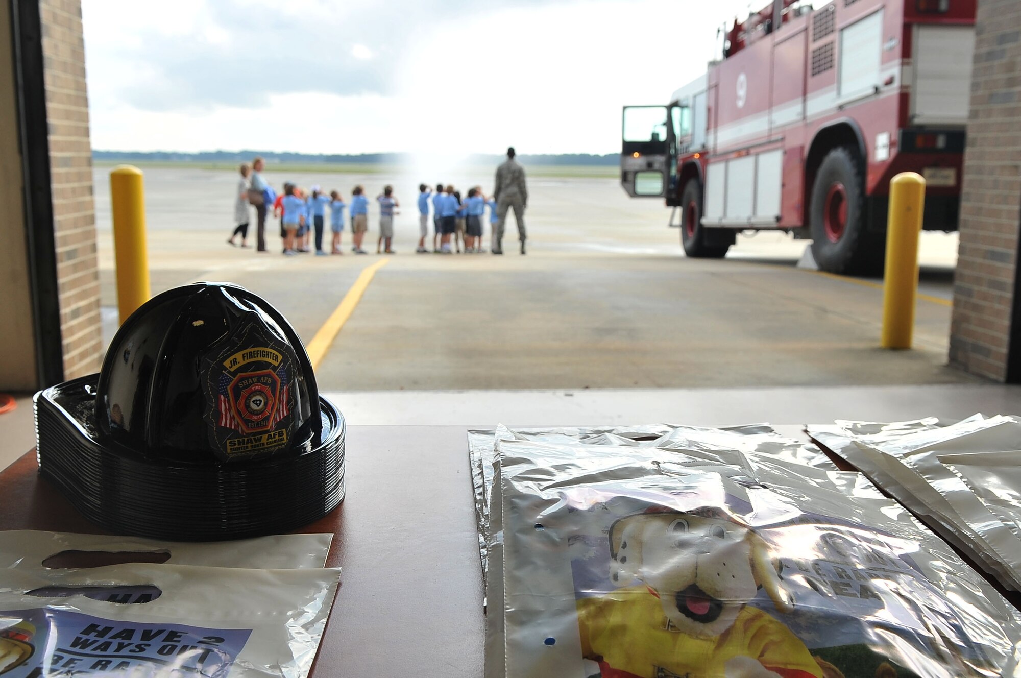 A bag of souvenirs is displayed to kindergartners during a fire department tour, Shaw Air Force Base, S.C., Oct. 2, 2012.The tour was given to children from Wilson Hall as October is fire prevention month. (U.S. Air Force photo by Airman 1st Class Ashley L. Gardner/ Released)