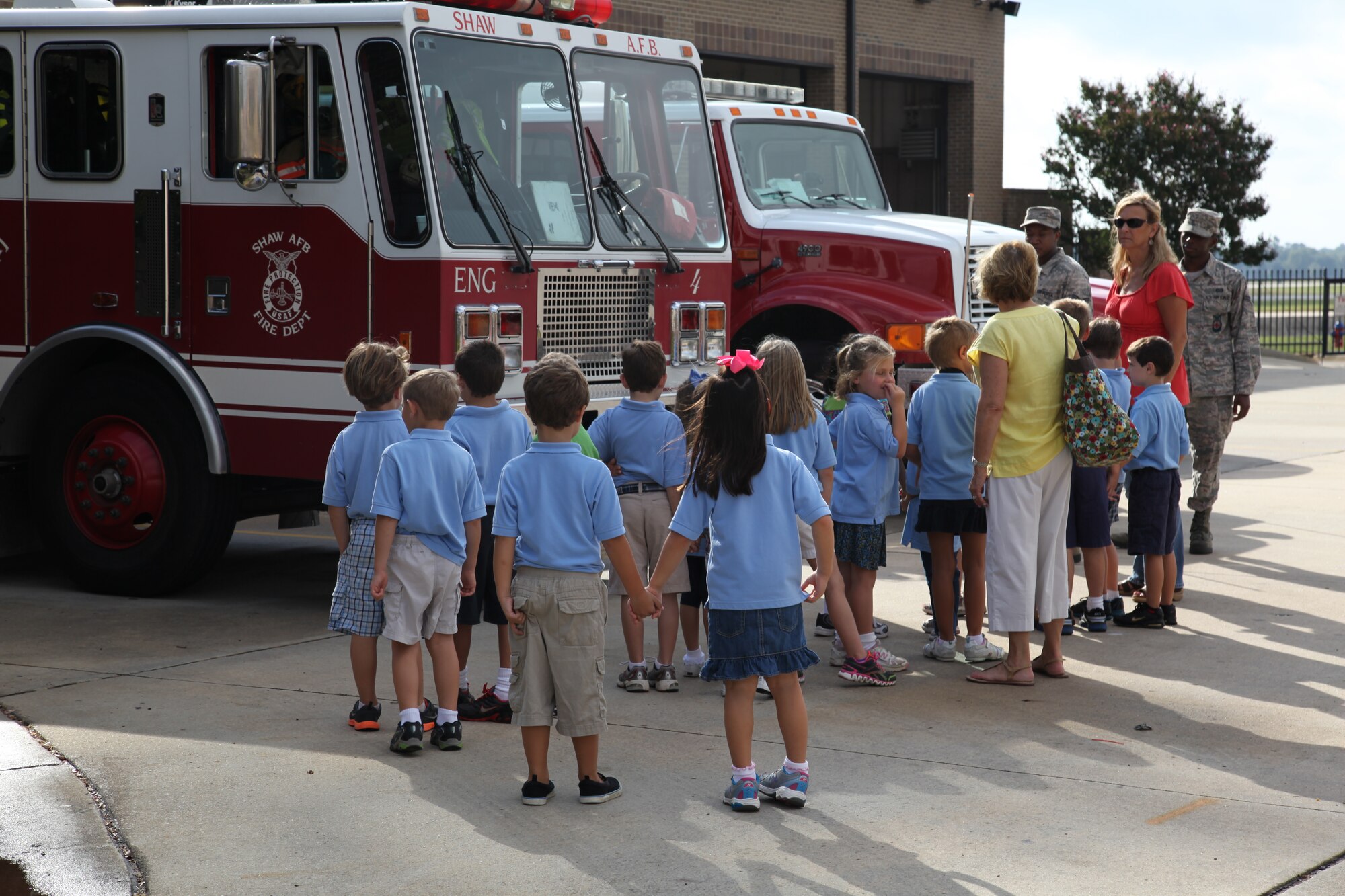 Wilson Hall students from Mrs. Noyes kindergarten class tour the fire trucks at the base fire station.  The Shaw Air Force Base fire department welcomed 60 Wilson Hall kindergartners for a tour Oct. 2, 2012.  (U.S. Air Force photo by 1st Lt. Ann Blodzinski/Released)