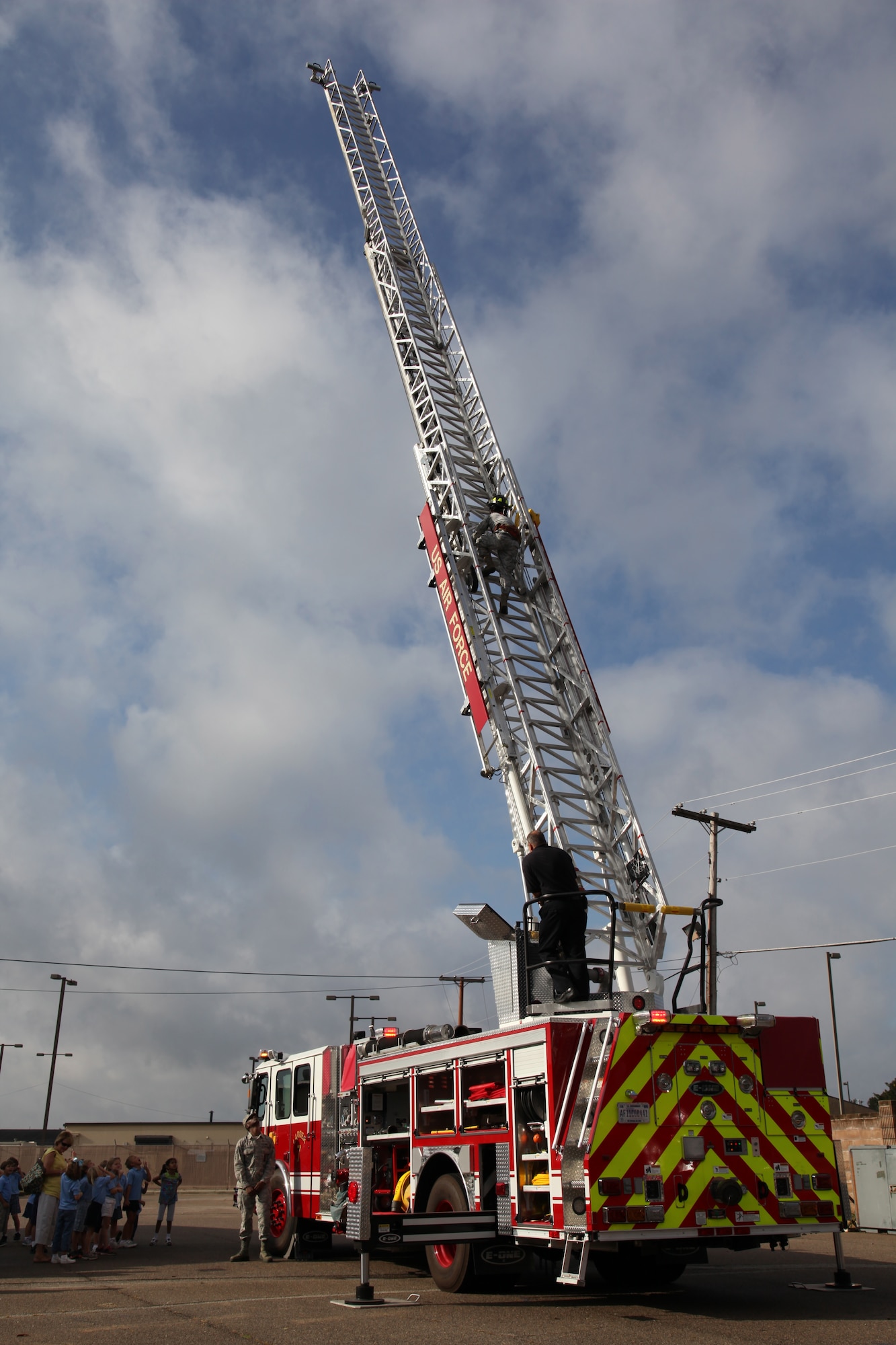 Shaw firefighters demonstrate the new ladder truck at the fire station.  The Shaw Air Force Base fire department welcomed 60 Wilson Hall kindergartners for a tour Oct. 2, 2012.  (U.S. Air Force photo by 1st Lt. Ann Blodzinski/Released)
