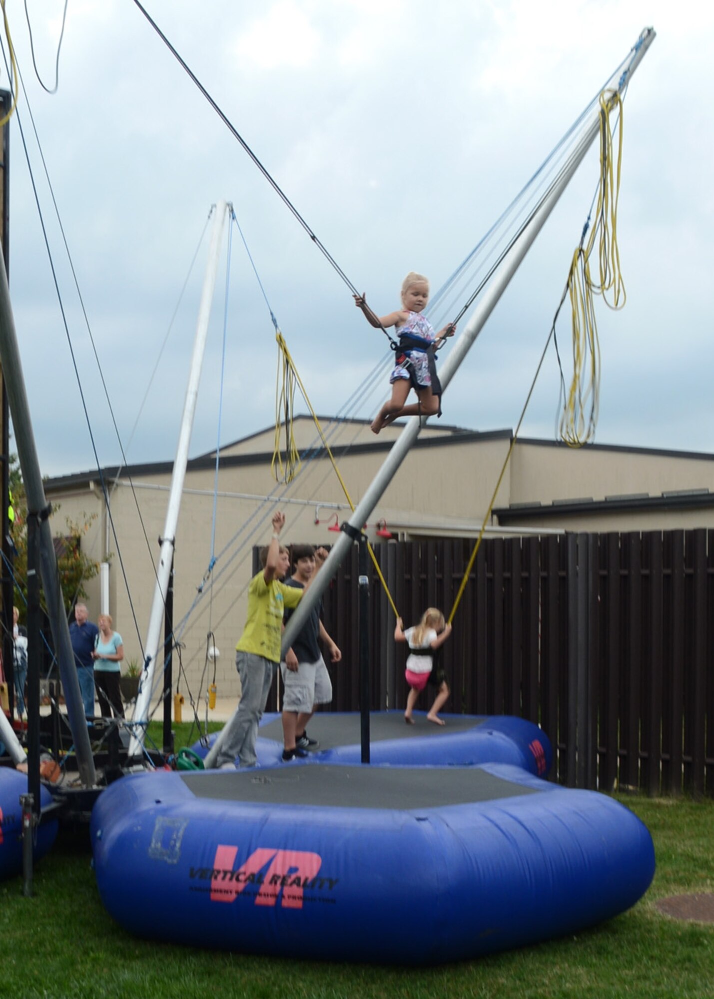 Children participate in the bungee jump during the Race Week Social Sept. 28, 2012, at The Landings Club on Dover Air Force Base, Del. Attendees had the opportunity to participate in various activities, receive autographs from NASCAR drivers, and enjoy free food. (U.S. Air Force photo by Tech. Sgt. Chuck Walker)
